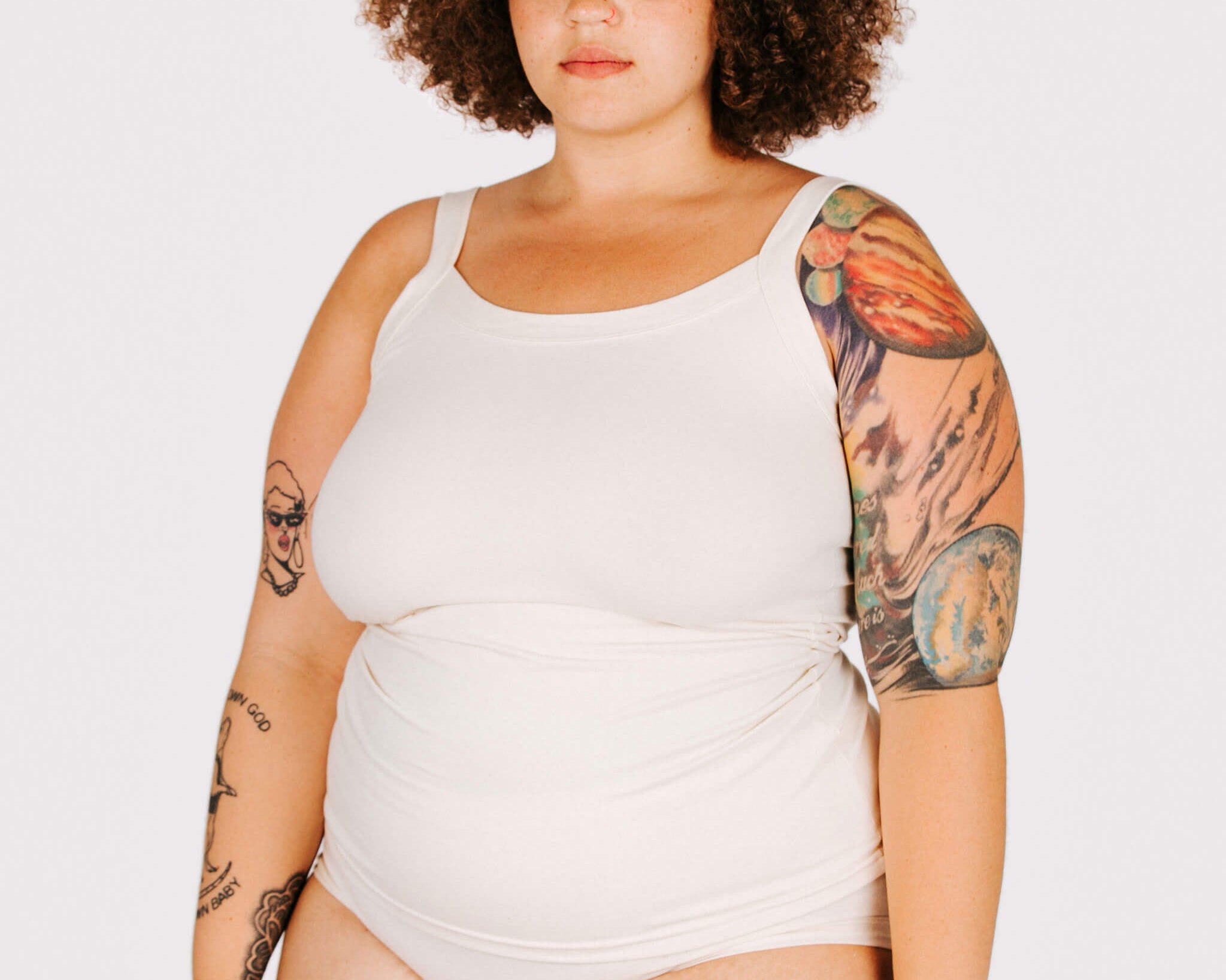 Fit photo from the front of Thunderpants organic cotton Camisole and Hipsters style underwear in off-white on a model.