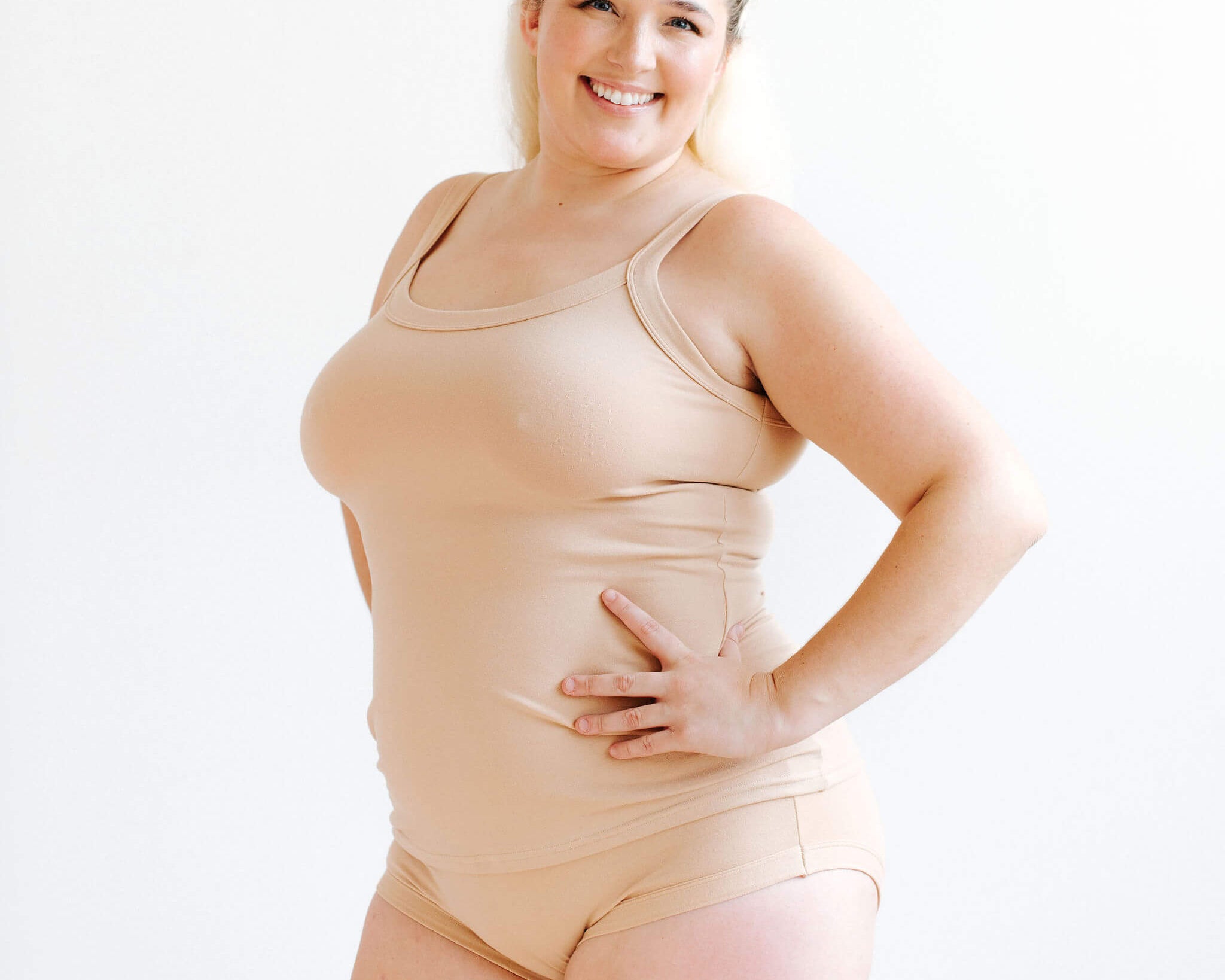 Model wearing Thunderpants Camisole and Hipster style underwear in Pine Nut - lighter tan color.