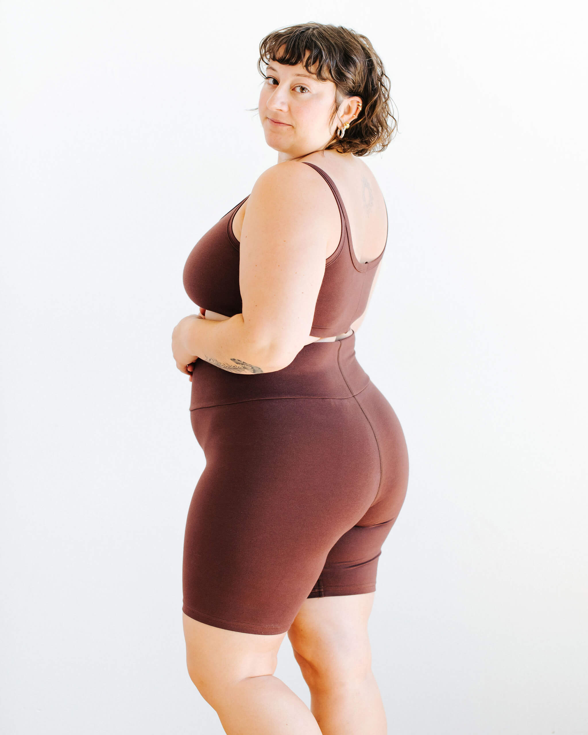 Model wearing Thunderpants Bike Shorts and Longline Bra in Chestnut - a dark brown color.