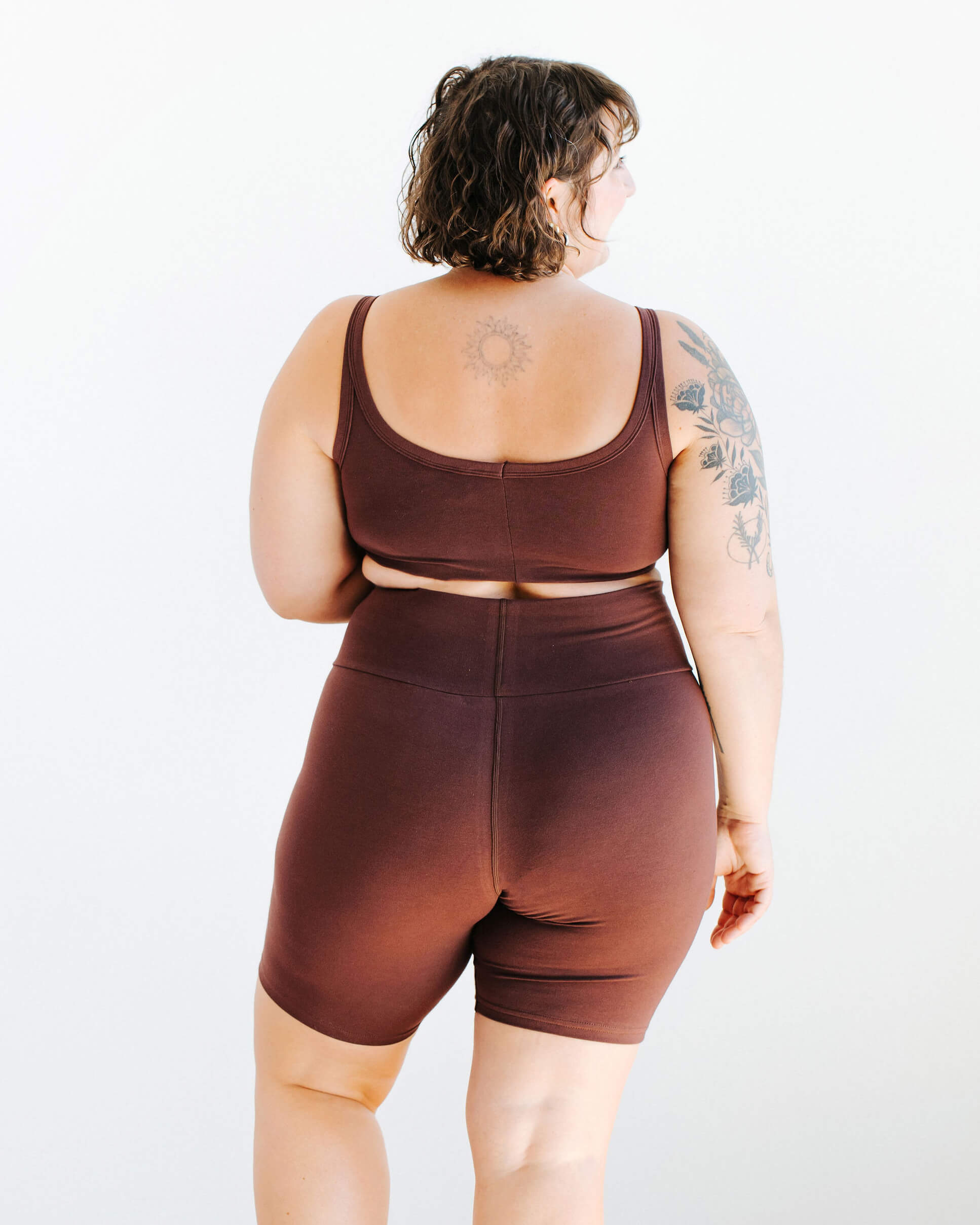 Model wearing Thunderpants Bike Shorts and Longline Bra in Chestnut - a dark brown color.