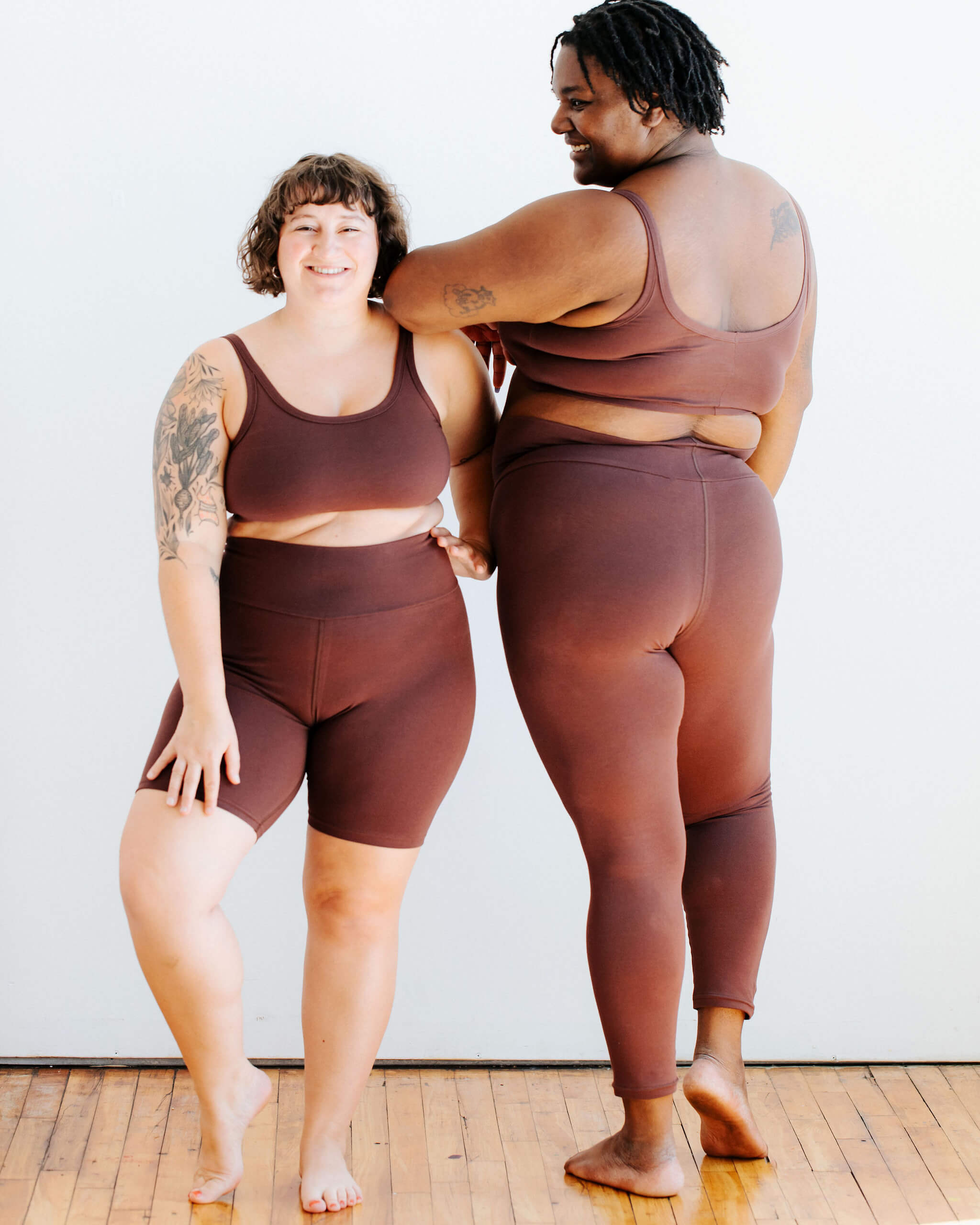 Two models wearing various Thunderpants items in Chestnut - a dark brown color.