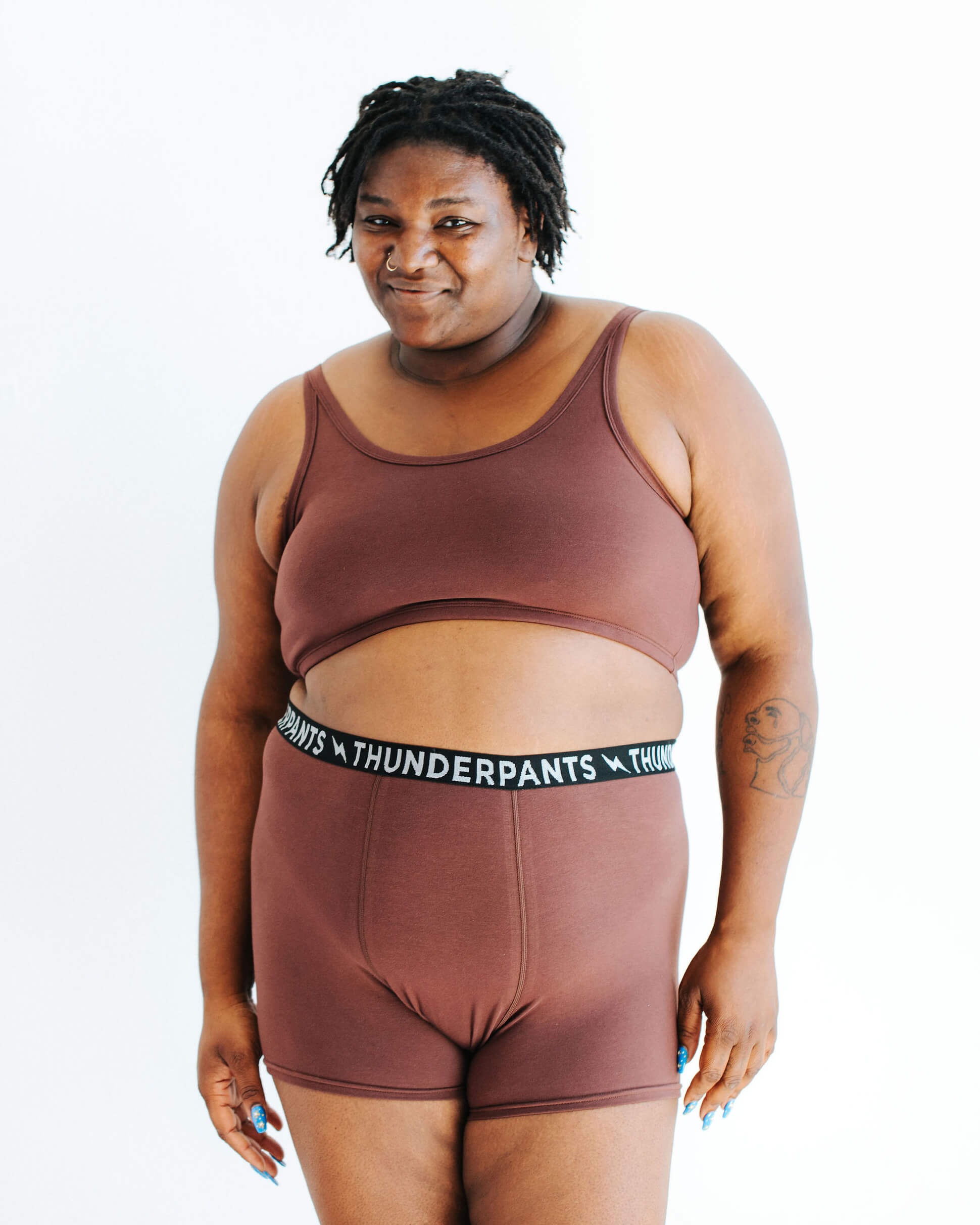 Model wearing Thunderpants Boxer Brief style underwear and Longline Bra in Chestnut - dark brown color.