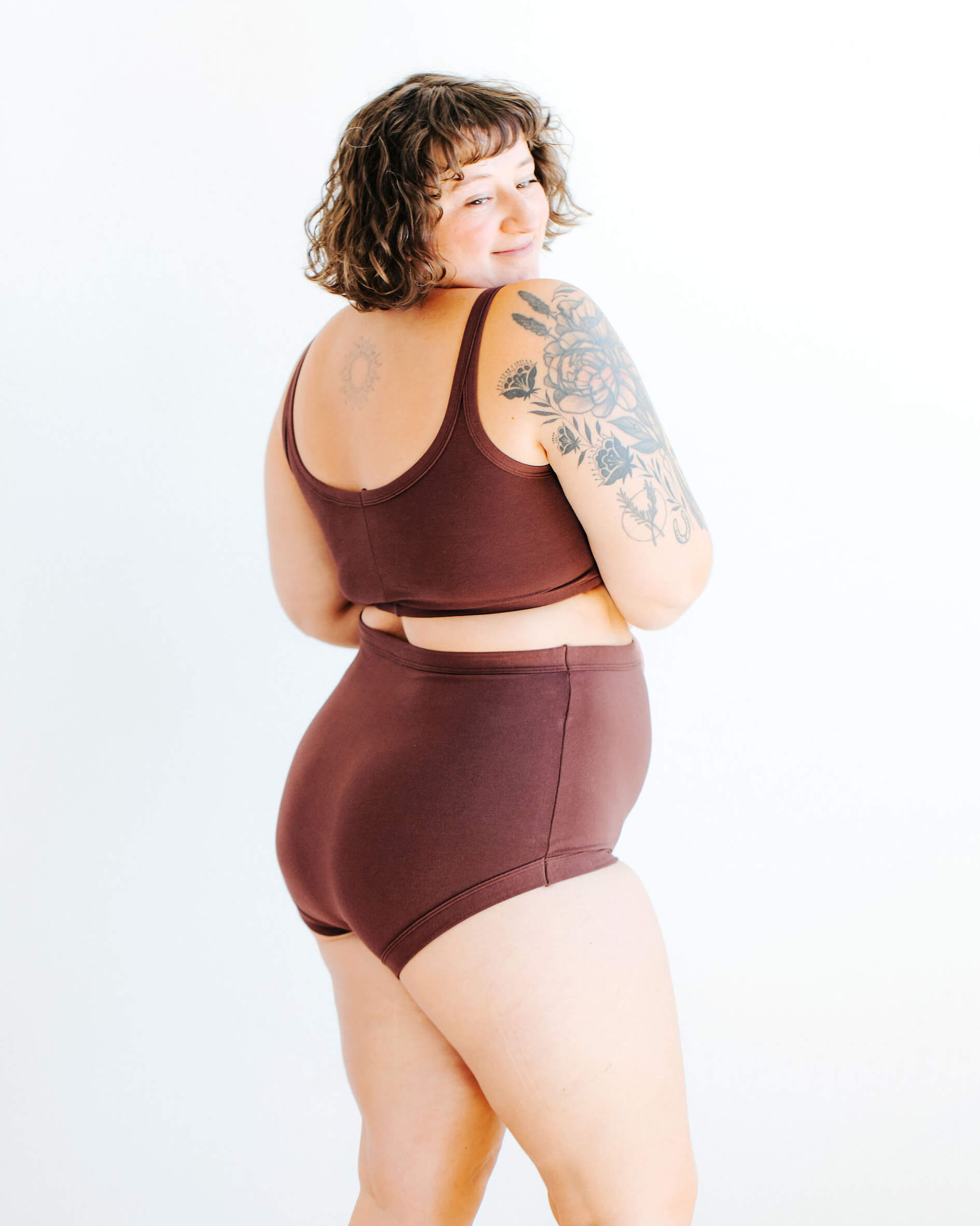 Model wearing Thunderpants Sky Rise style underwear and Longline Bra in Chestnut - a dark brown color.