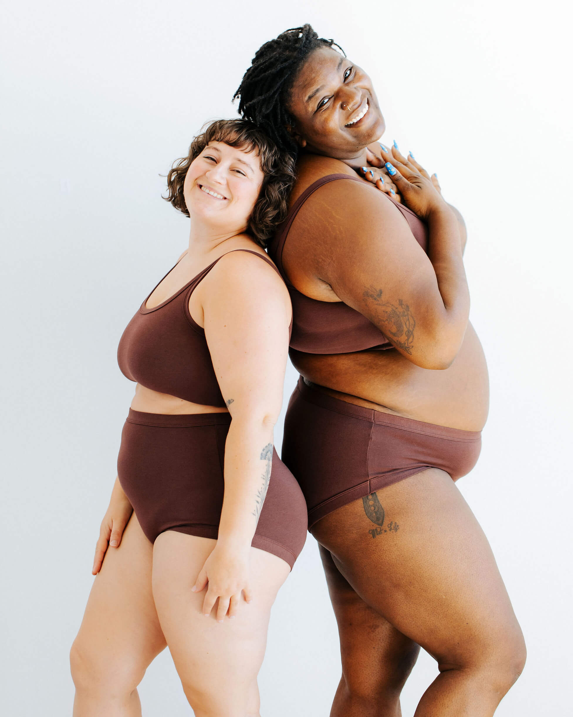 Two models wearing various Thunderpants items in Chestnut - a dark brown color.