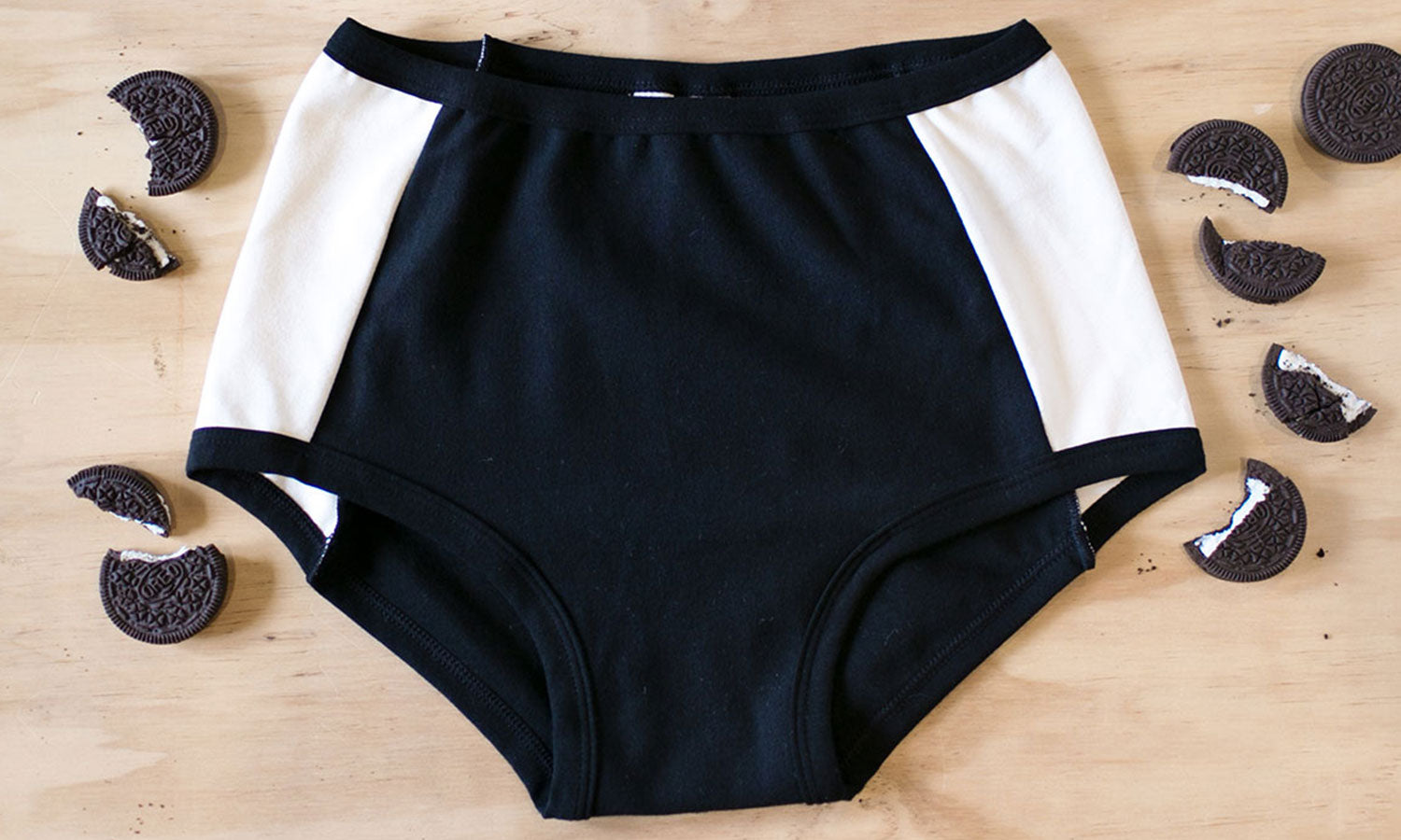 Flat lay of Thunderpants Panel Pant Original style underwear in Cookies and Cream - black center and white sides.