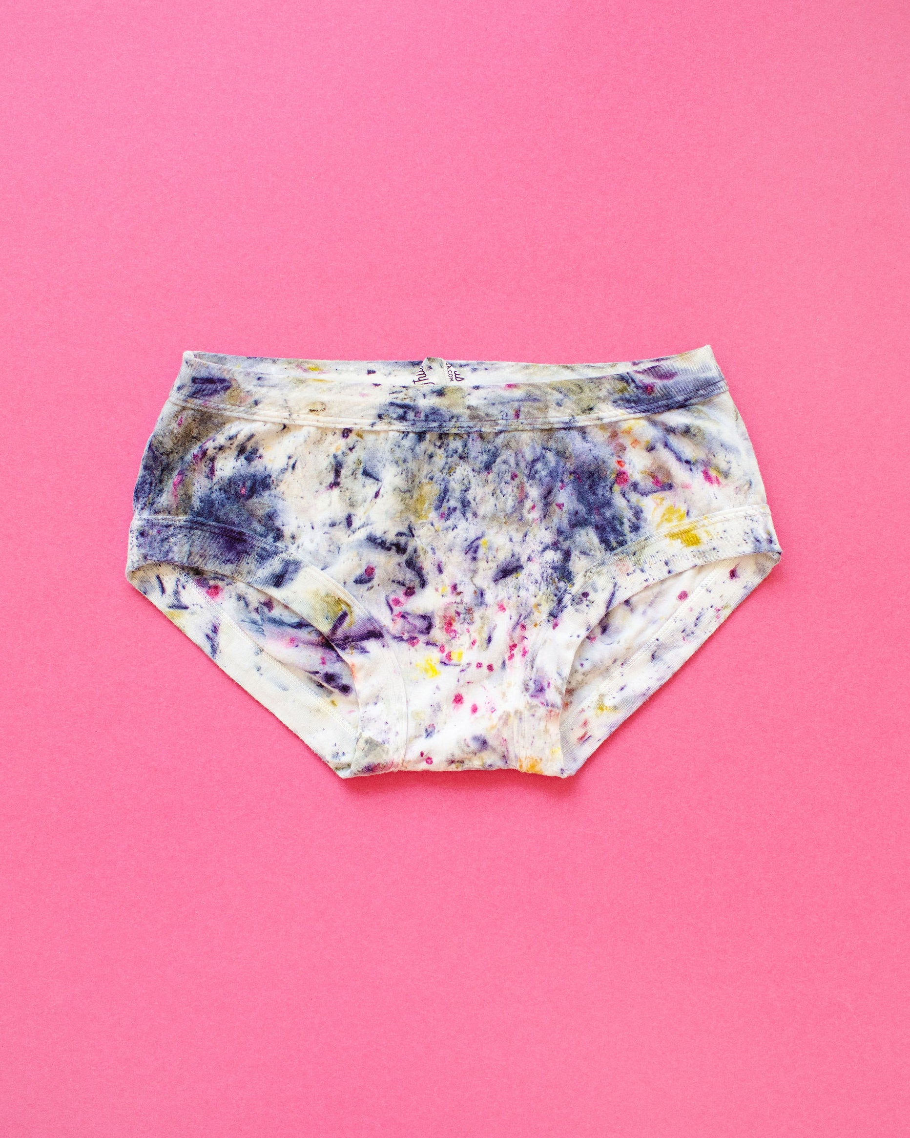 Flat lay of Thunderpants Hipster style underwear in Cosmic Compost hand dye.