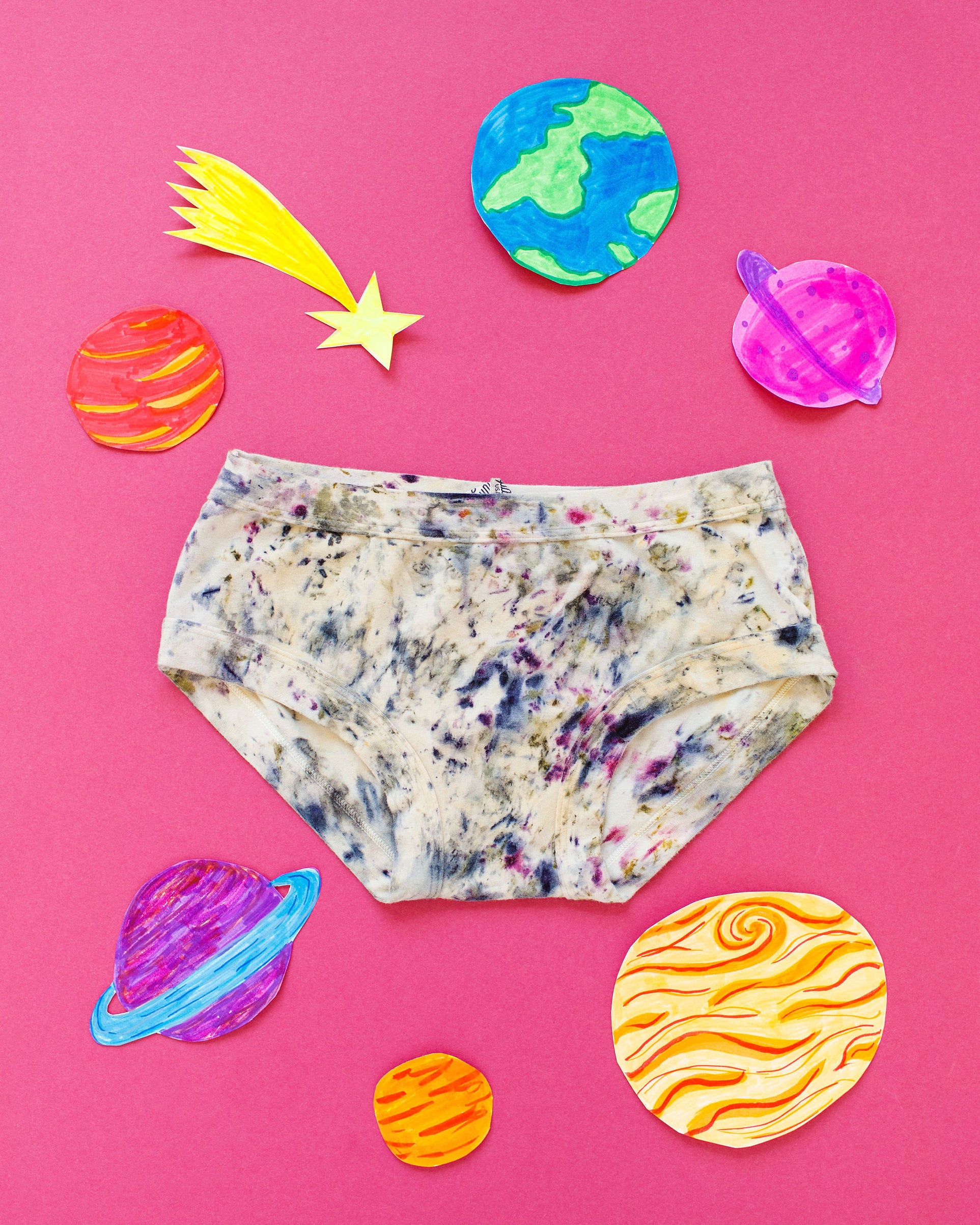 Flat lay of Thunderpants Hipster style underwear in Cosmic Compost hand dye.