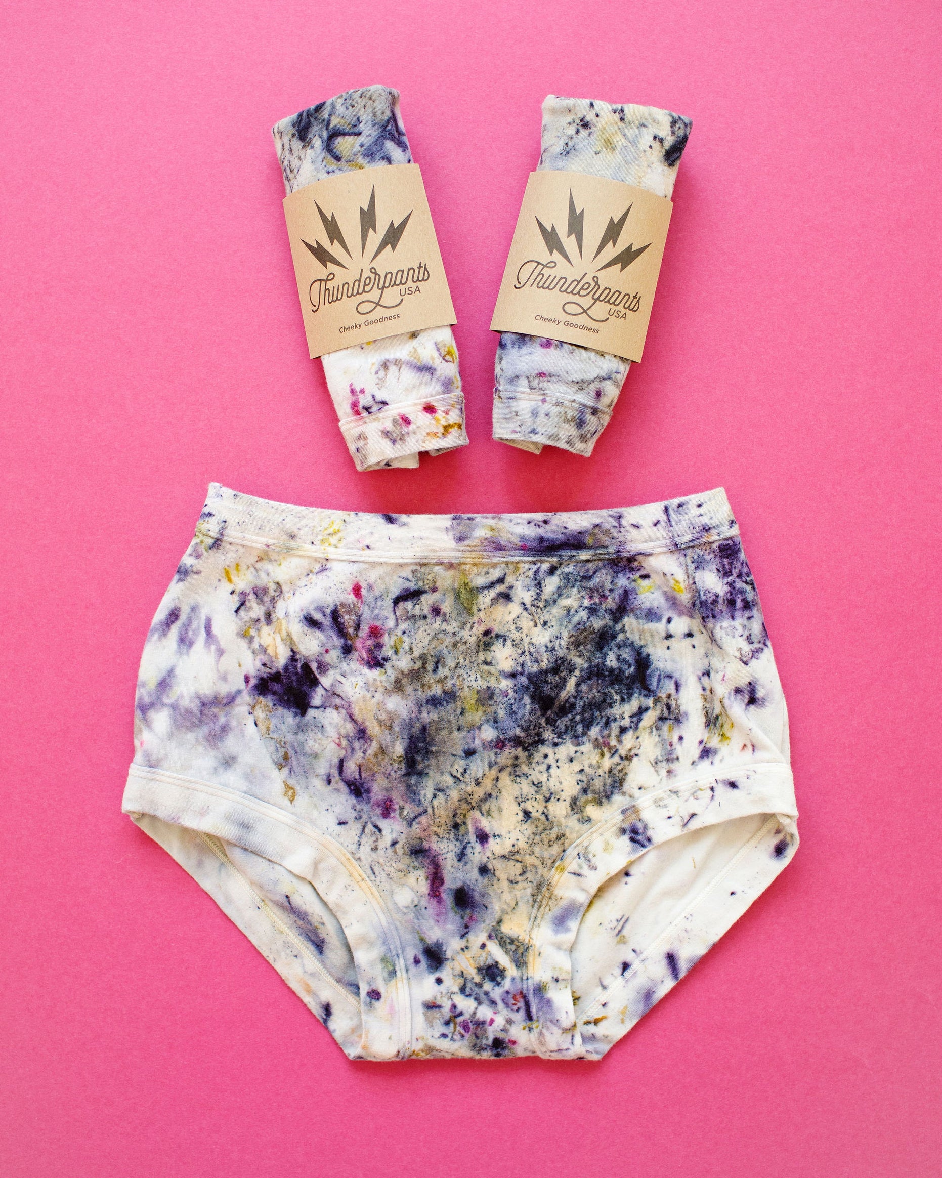 Flat lay of Thunderpants Organic Cotton underwear in Cosmic Compost hand dye.