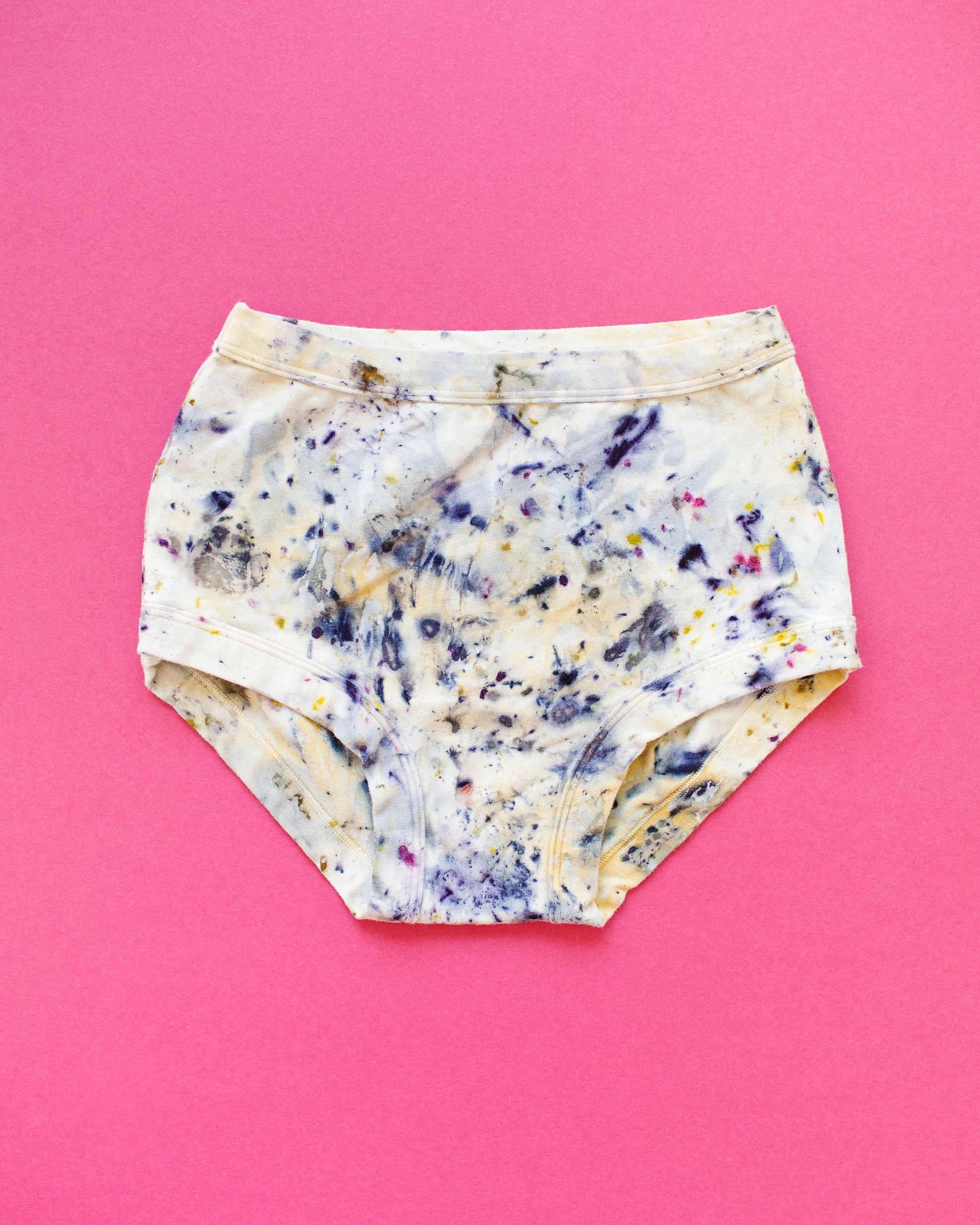 Flat lay of Thunderpants Original style underwear in Cosmic Compost hand dye.