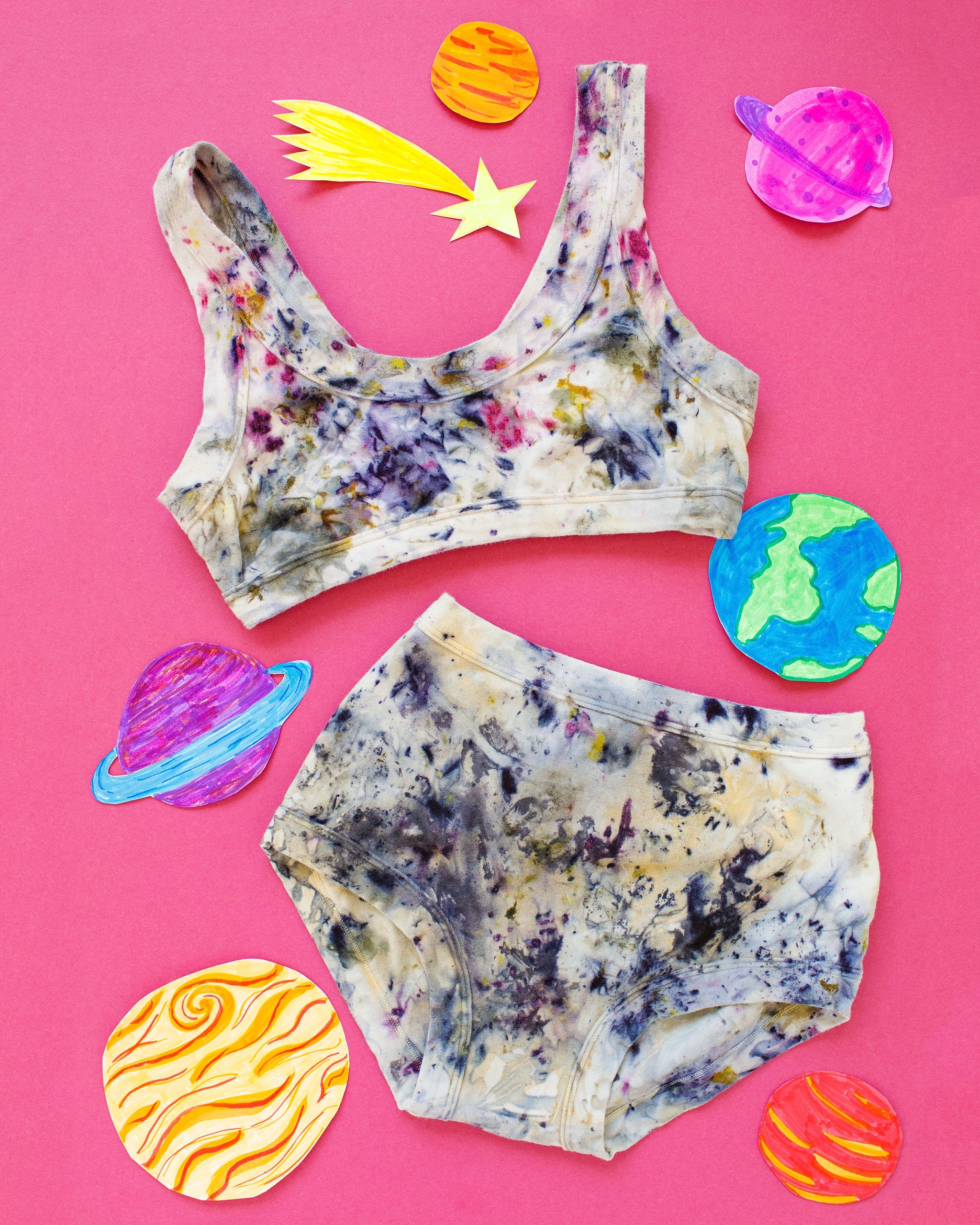 Flat lay of Thunderpants Original style underwear and Bralette set in Cosmic Compost hand dye.