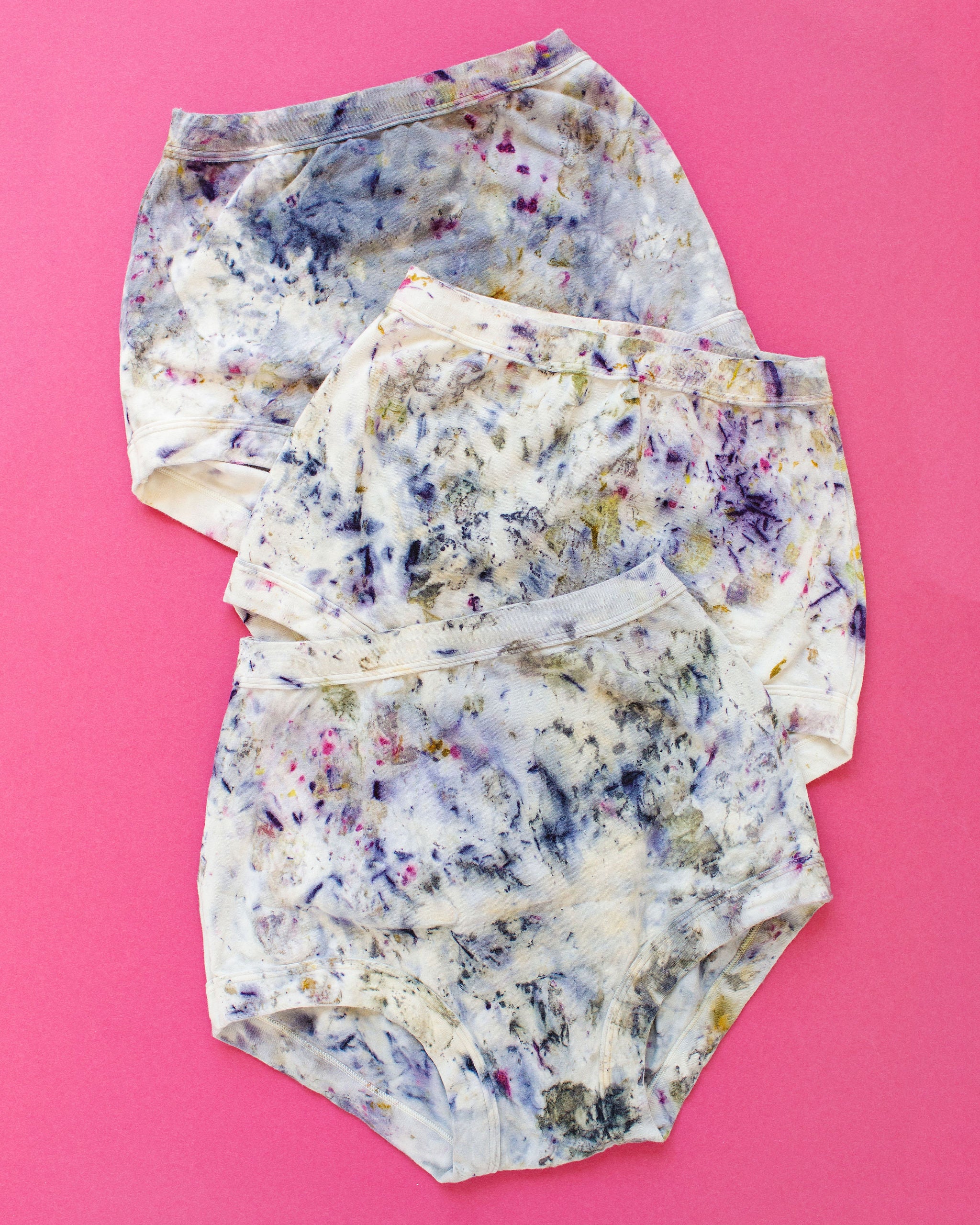 Flat lay of three Thunderpants Sky Rise style underwear in Cosmic Compost.