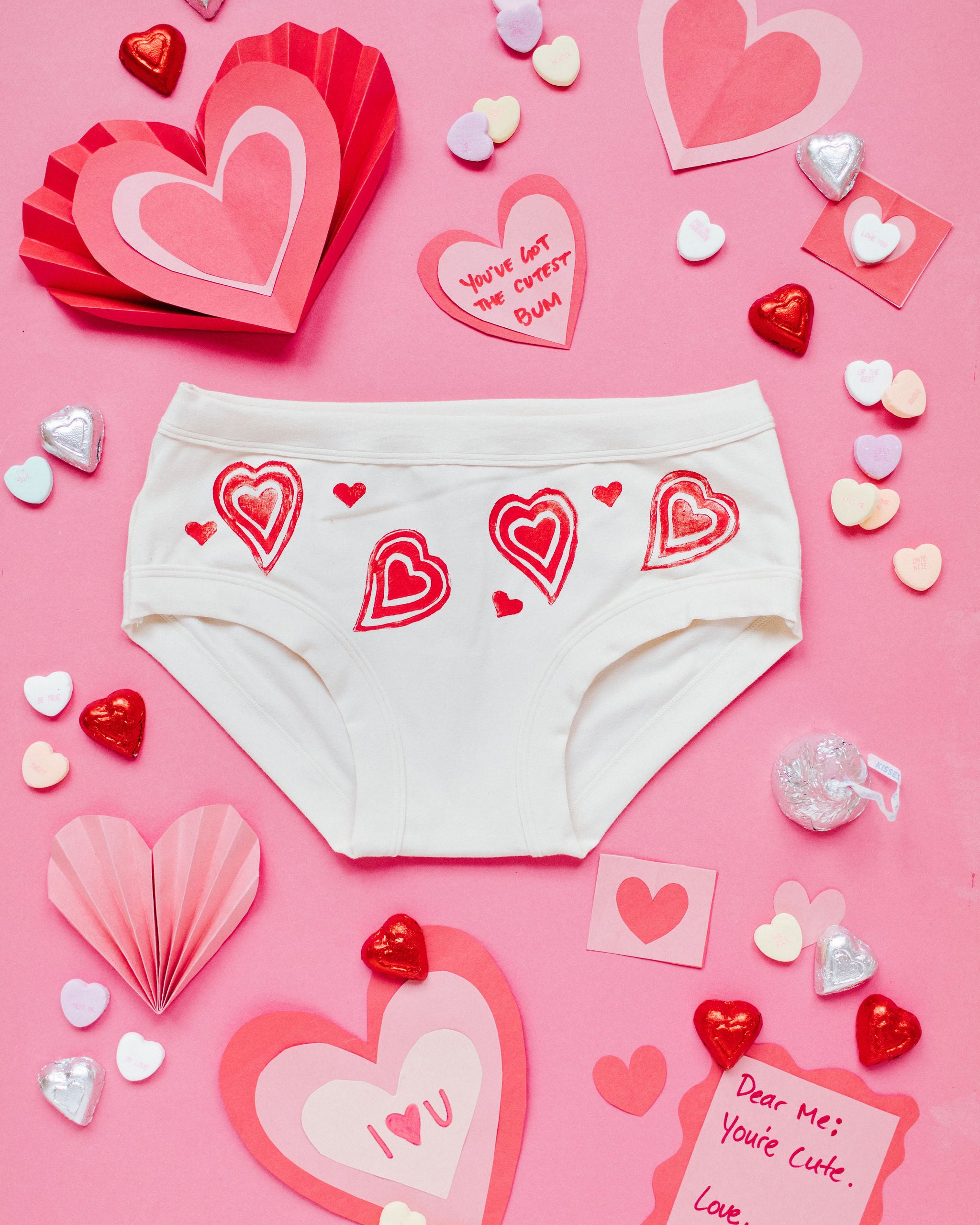 Flat lay of Thunderpants Hipster style underwear with hand printed red hearts on Vanilla.
