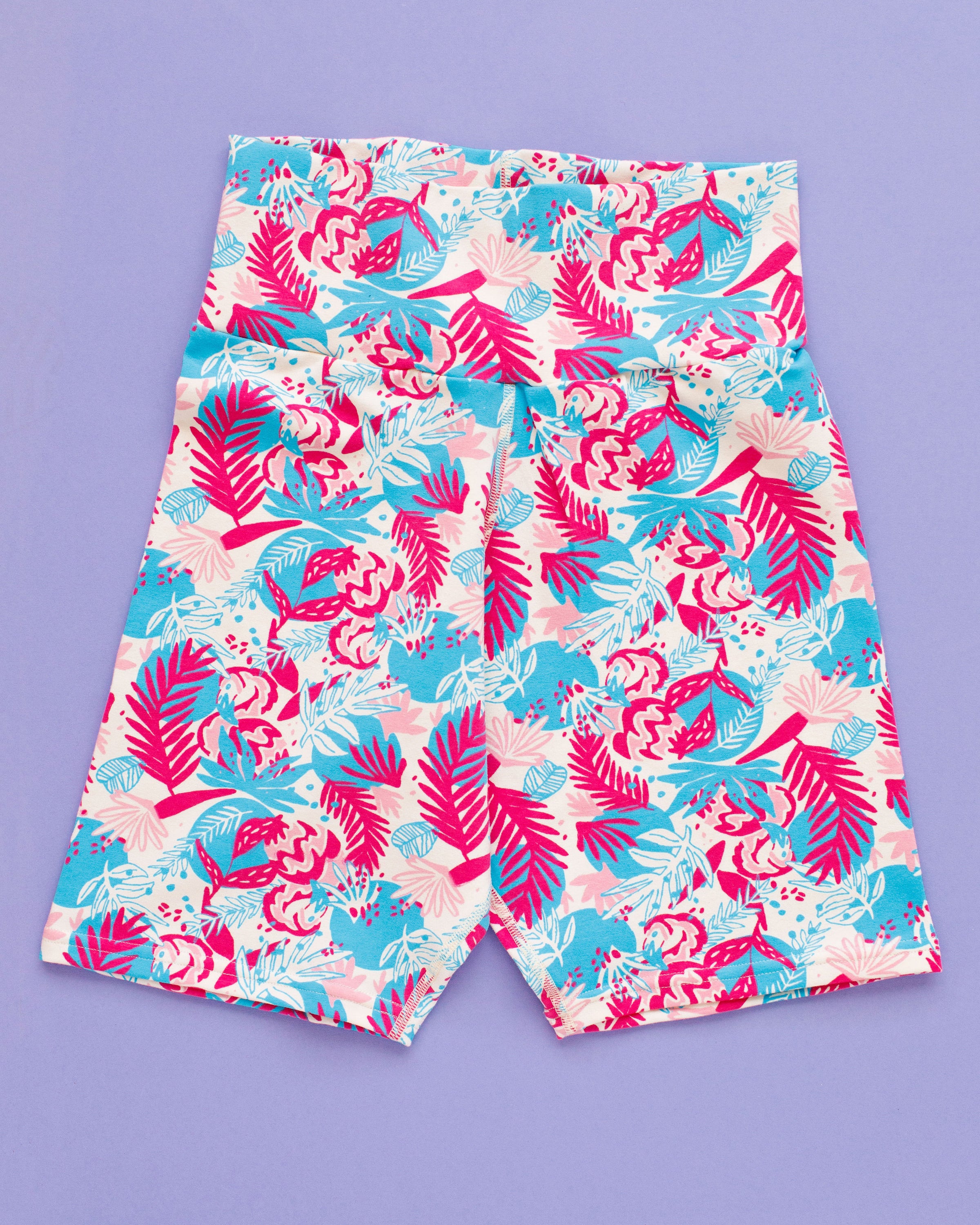 Flat lay of Thunderpants Bike Shorts in Finding Flamingo print.