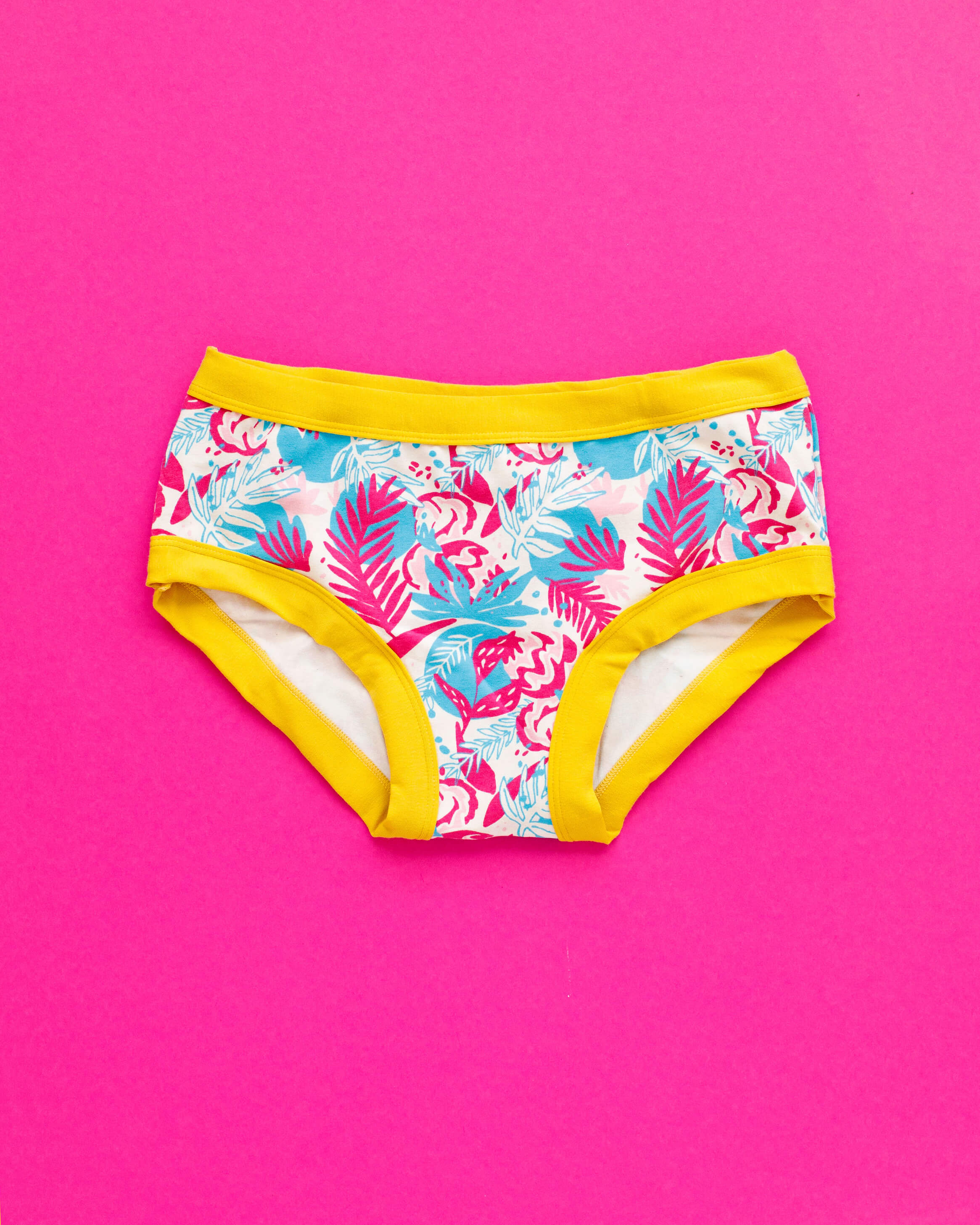 Flat lay of Thunderpants Hipster style underwear in Flamingo Lemonade - Finding Flamingo print with yellow binding.