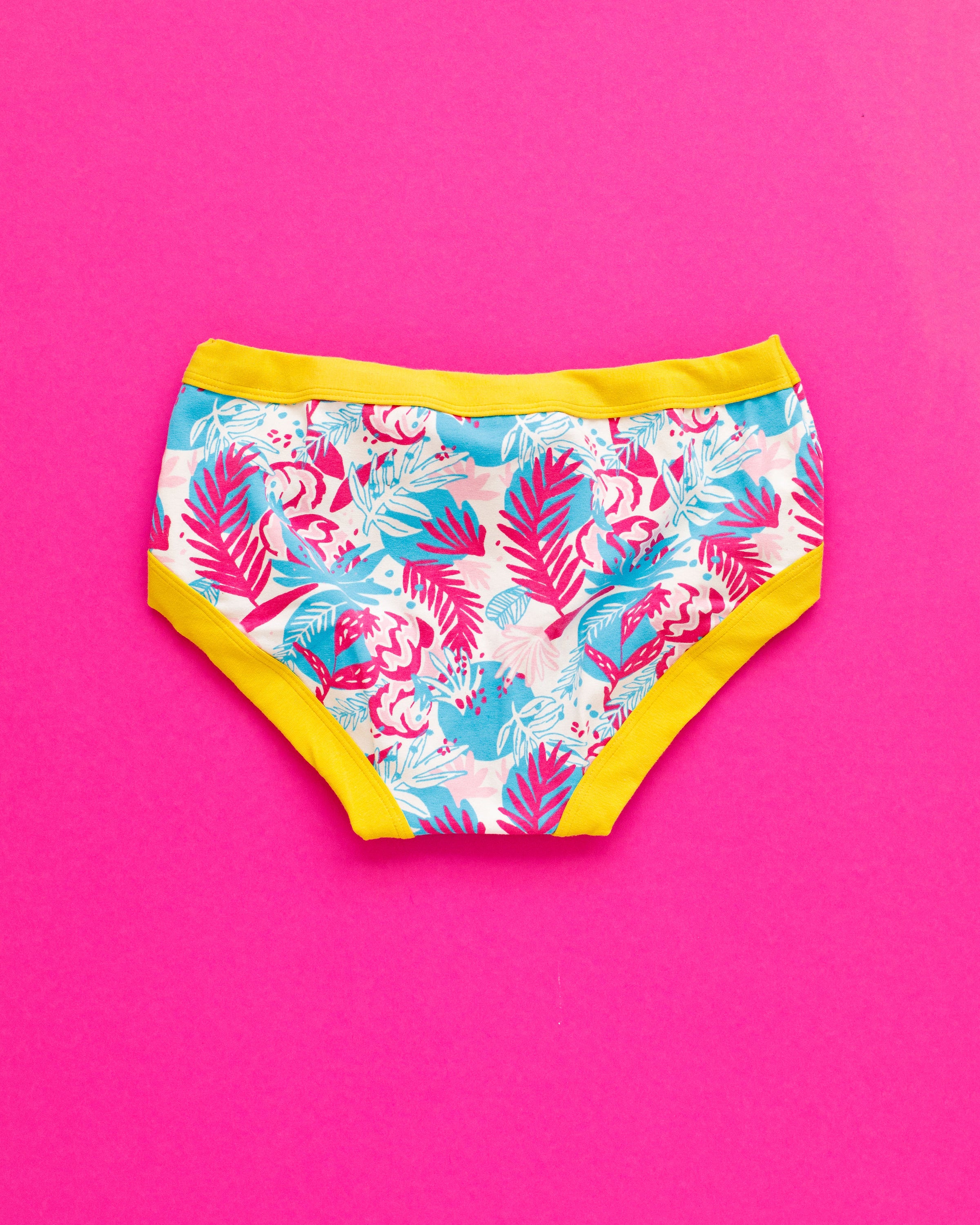 Flat lay of Thunderpants Hipster style underwear in Flamingo Lemonade - Finding Flamingo print with yellow binding.