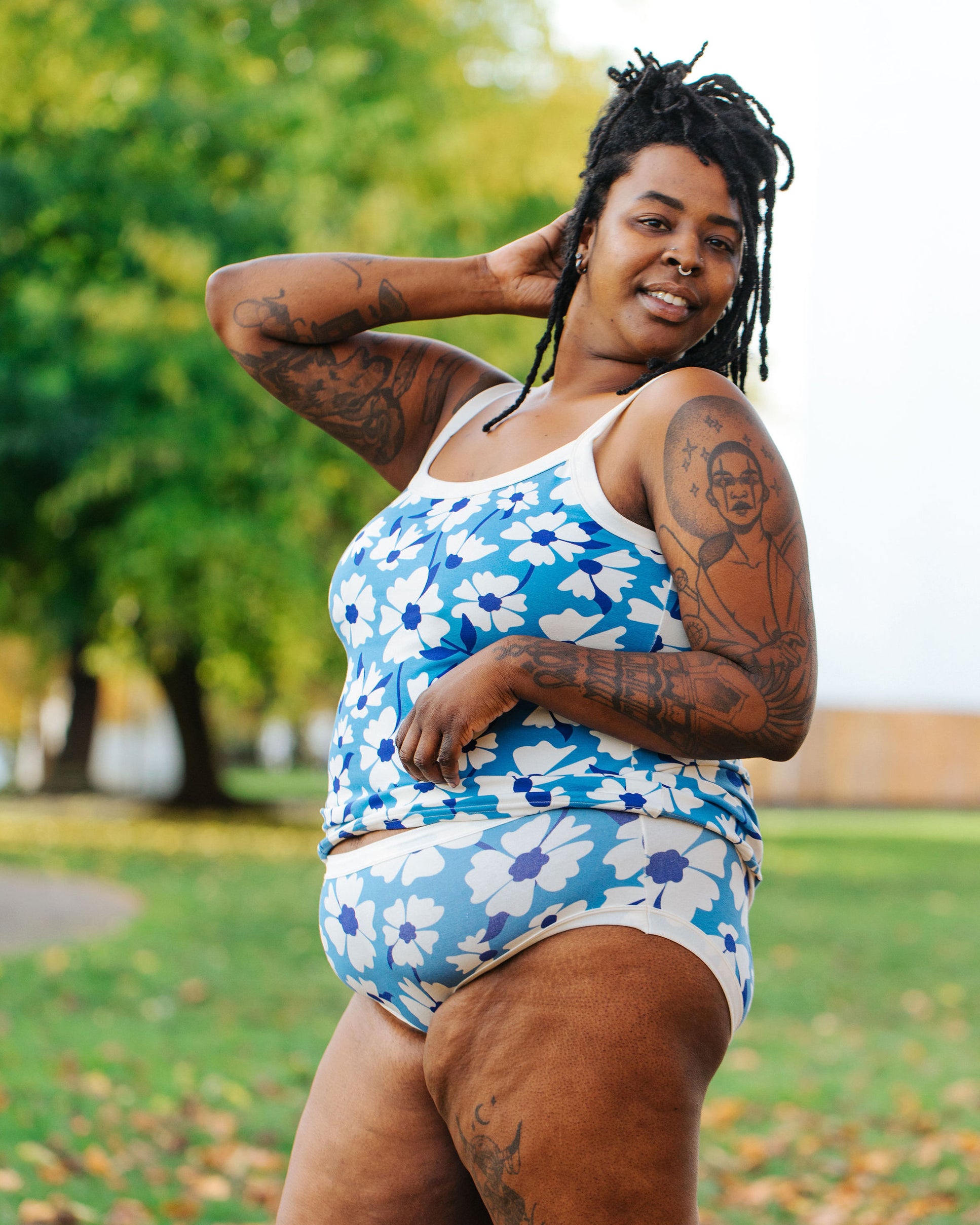 Model of Thunderpants Hipster style underwear and Camisole in Moody Blooms - white and blue flowers with blue background.