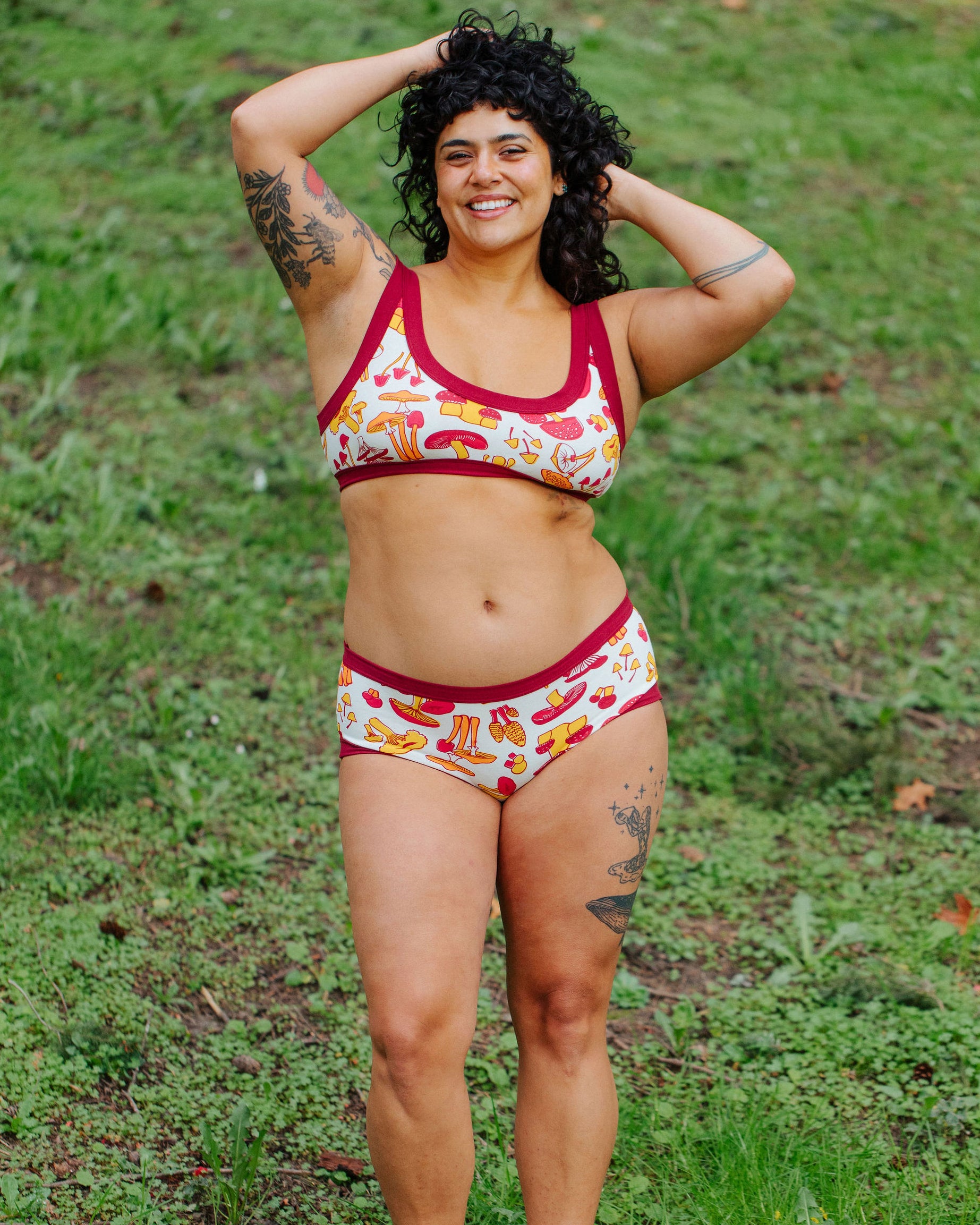 Model wearing Thunderpants Hipster style underwear and Bralette in Whadda Mushroom - red, yellow, and orange mushrooms.