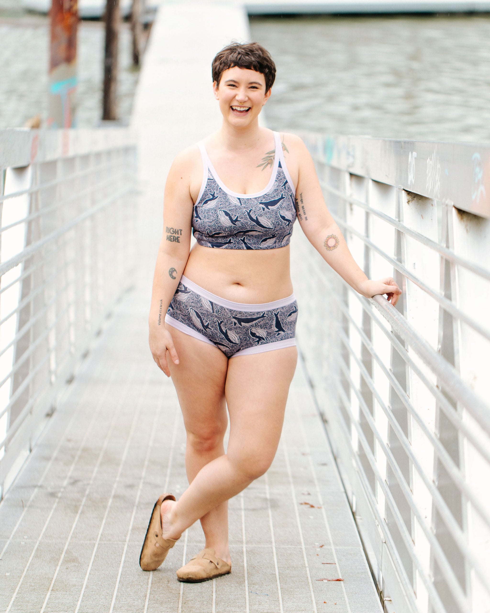 Model wearing Thunderpants Hipster style underwear and Longline Bra in Whale, Whale, Whale print - indigo whales on lavender.