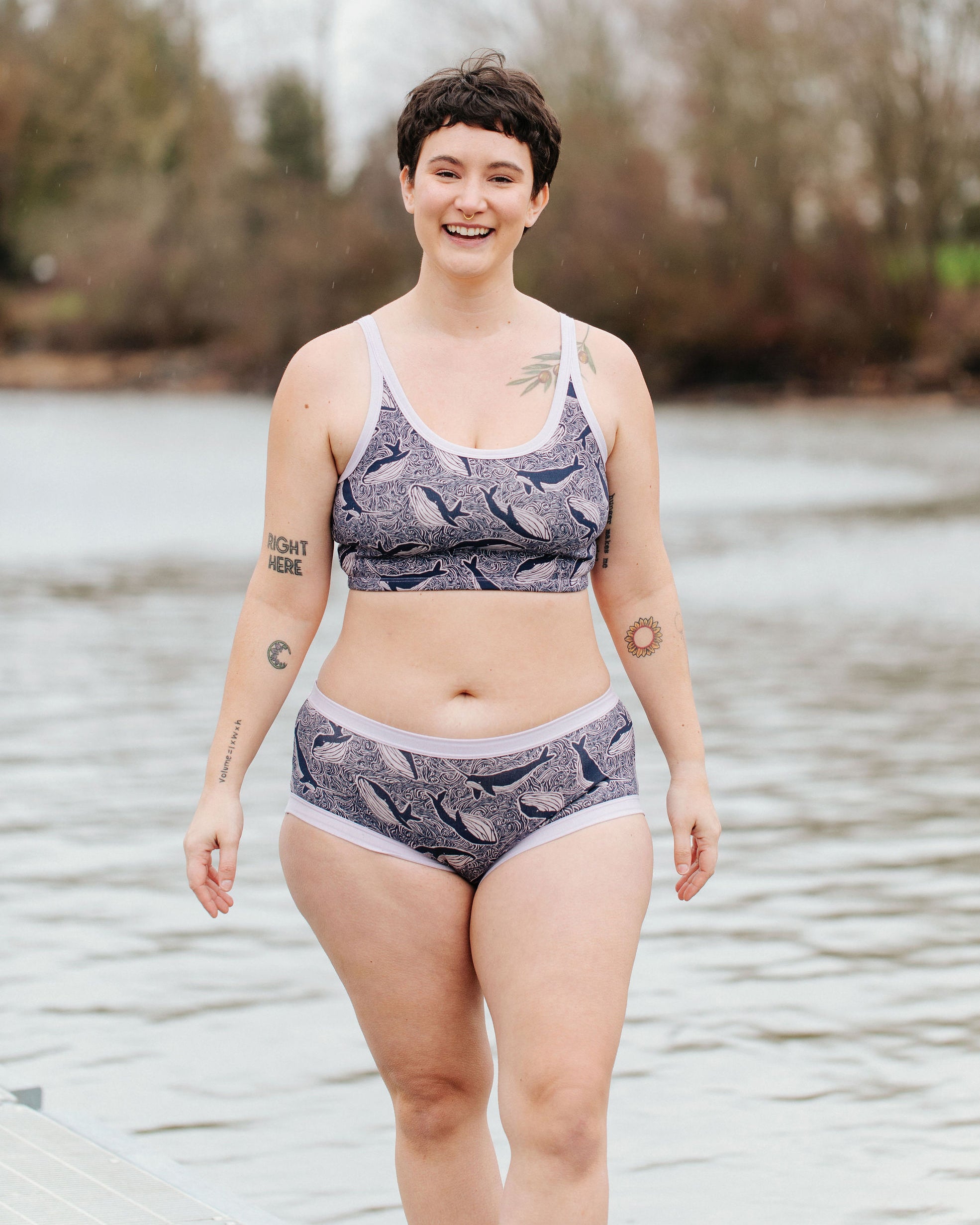 Model wearing Thunderpants Hipster style underwear and Longline Bra in Whale, Whale, Whale print - indigo whales on lavender.