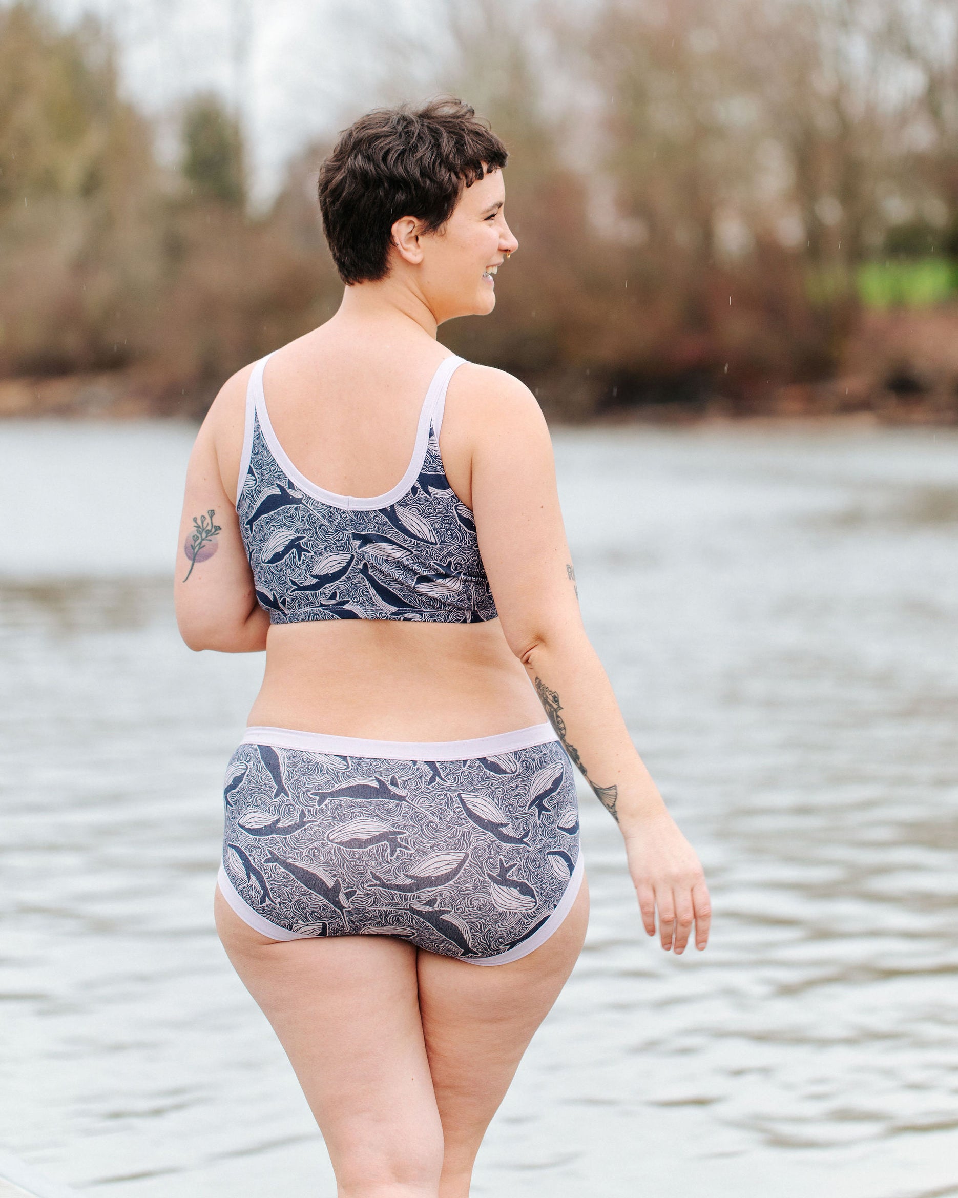 Model wearing Thunderpants Hipster style underwear and Longline Bra in Whale, Whale, Whale print - indigo whales on lavender.