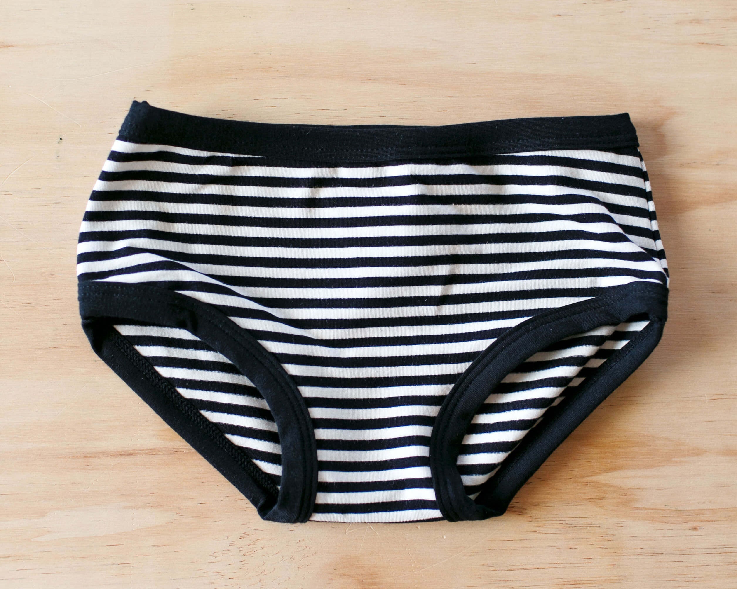 Flat lay of Thunderpants Kid's underwear in Black and White Stripe.