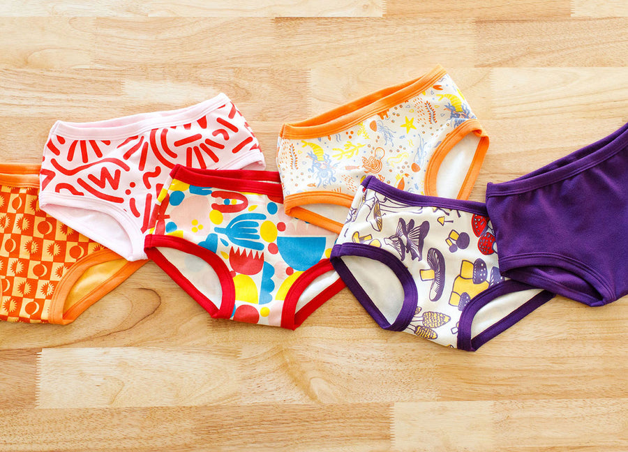 Flat lay of six different prints in Thunderpants kids style.