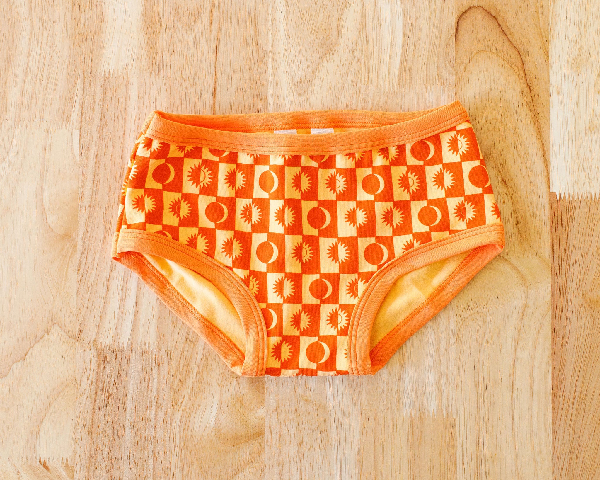 Flat lay of Thunderpants Kids underwear in Autumn Equinox print.