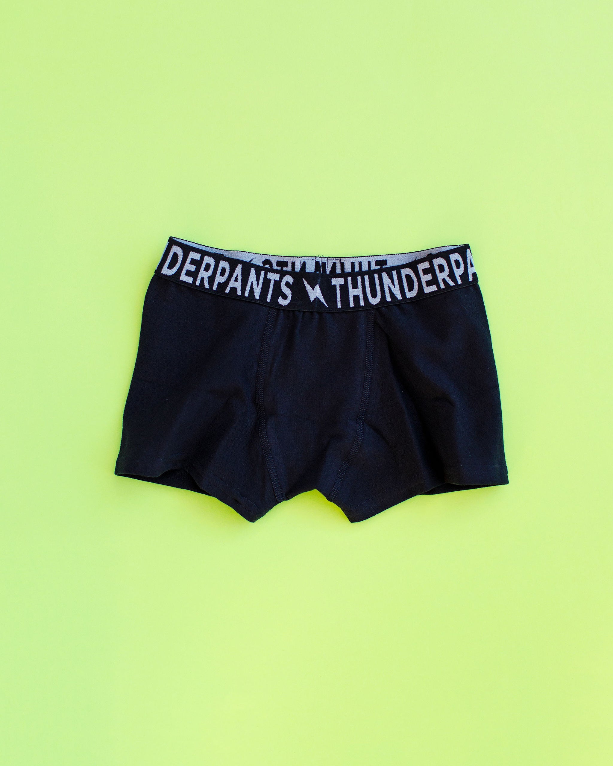 Flat lay of Thunderpants Kids Boxer Brief style underwear in Plain Black.
