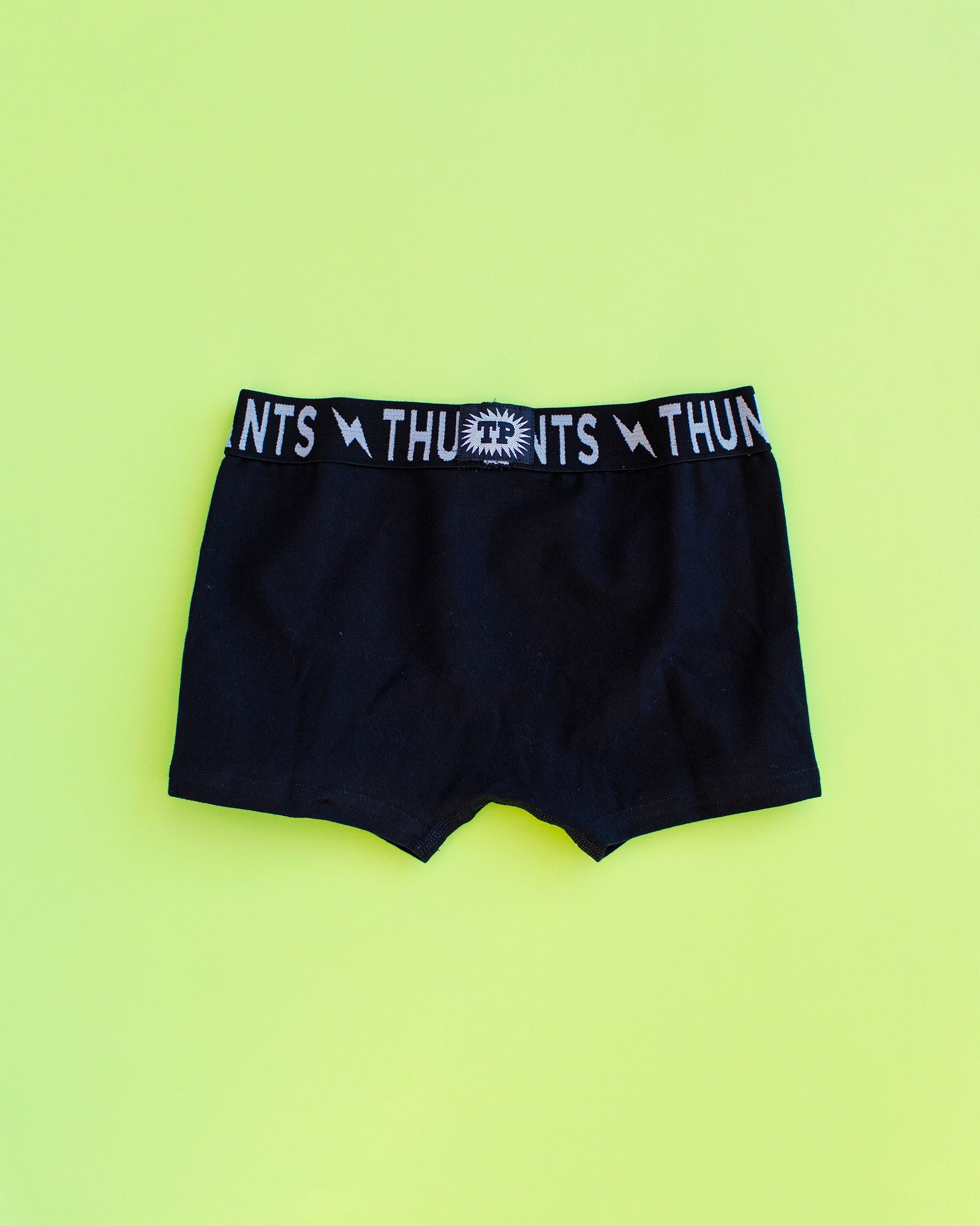 Flat lay of Thunderpants Kids Boxer Brief style underwear in Plain Black.
