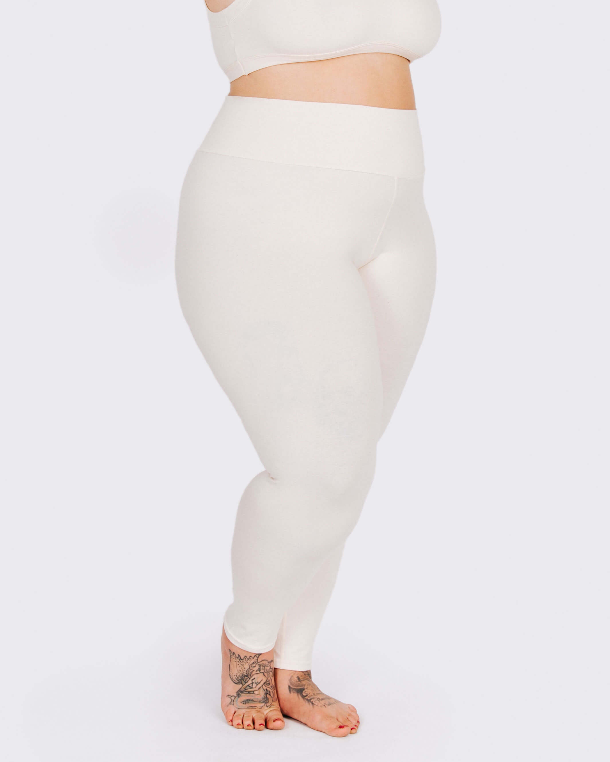 Fit photo from the front of Thunderpants organic cotton Leggings in off-white on a model.