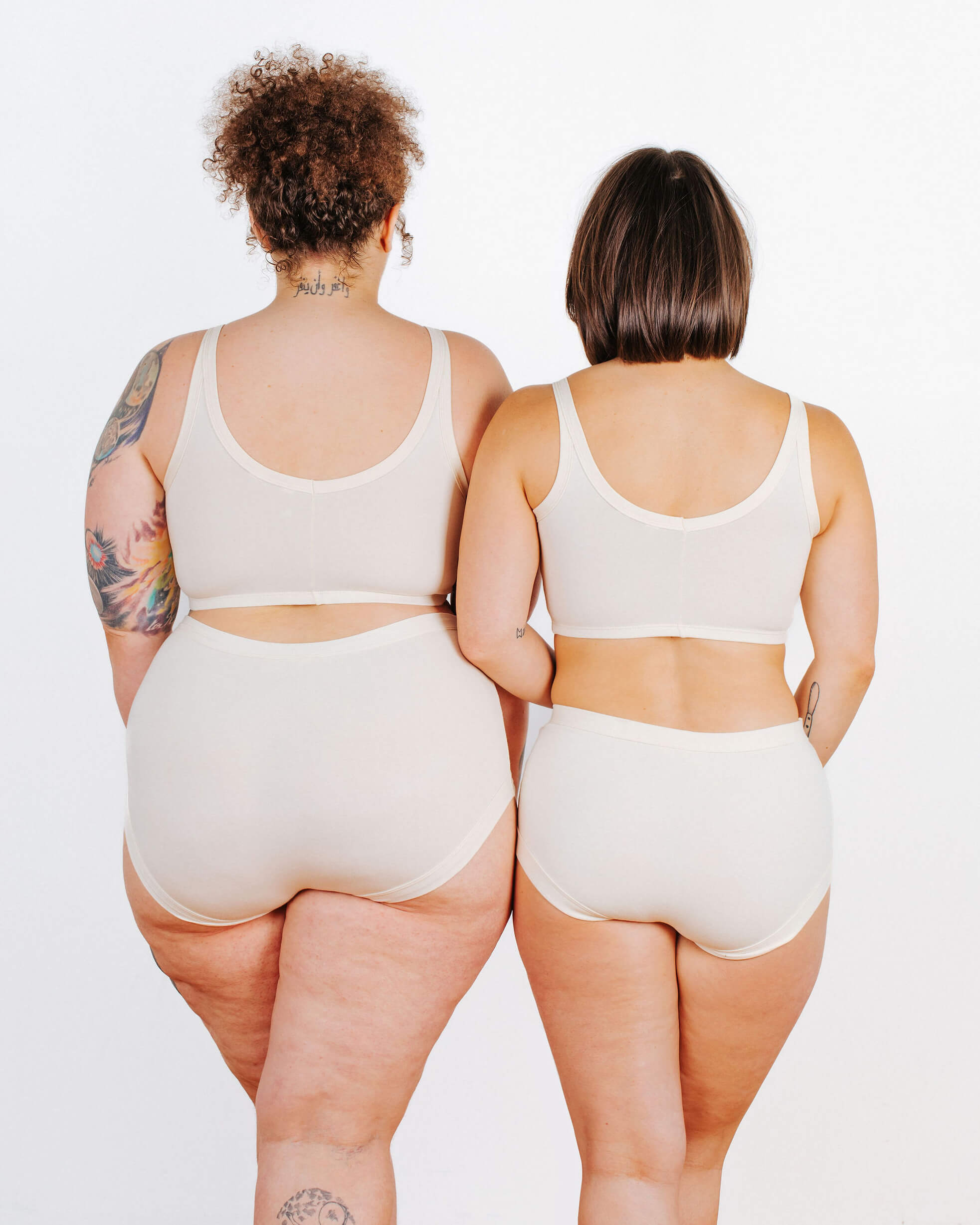 Fit photo from the back of Thunderpants organic cotton Longline Bra and Original style underwear on two models. 