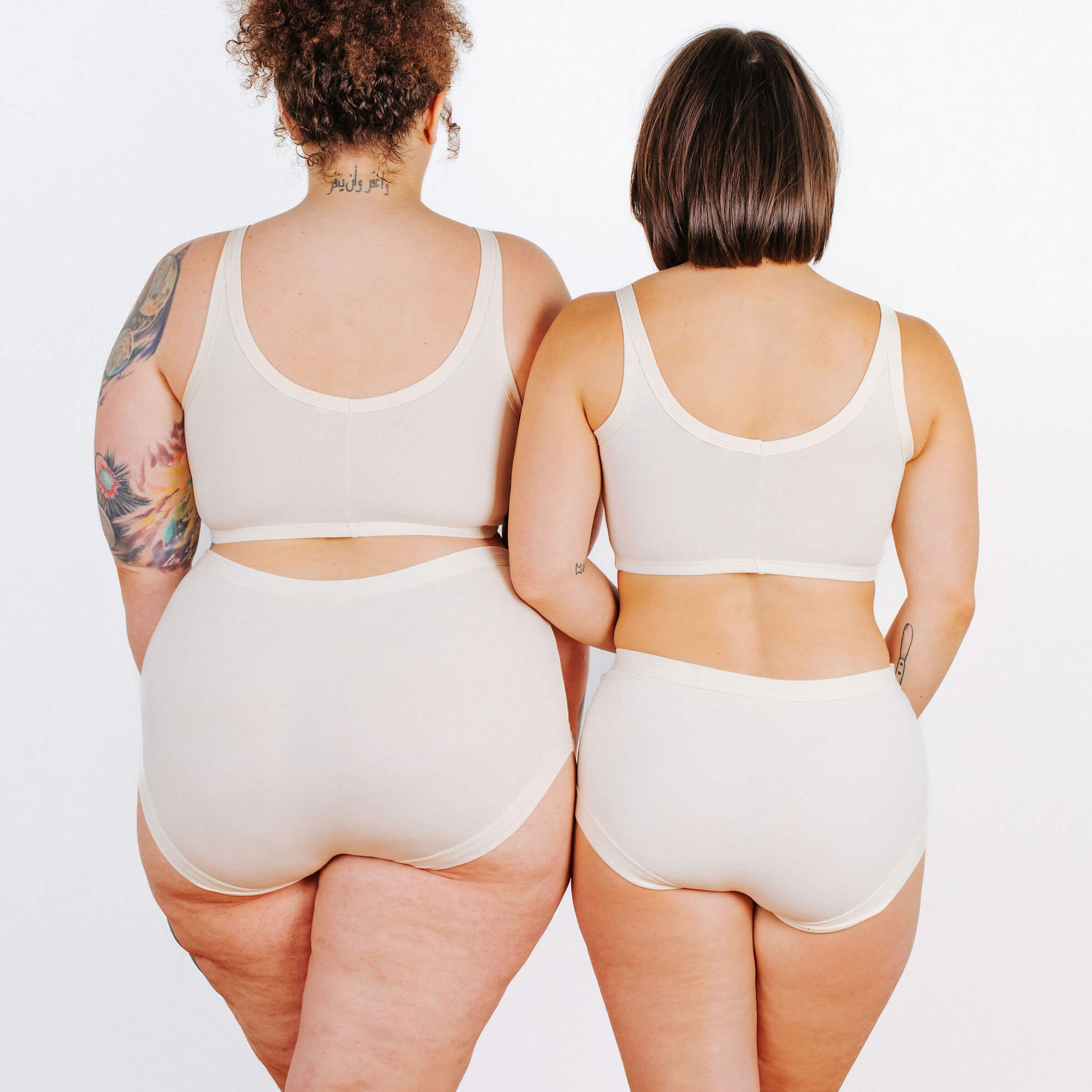 Fit photo from the back of Thunderpants organic cotton Longline Bra and Original style underwear on two models. 