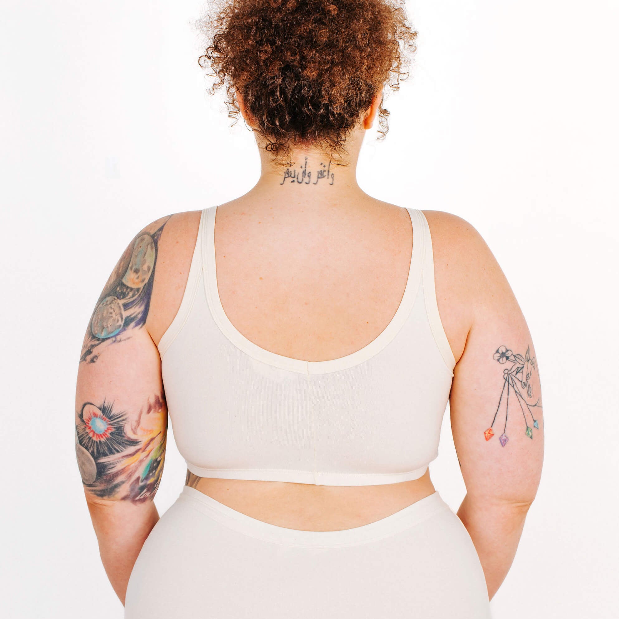 Fit photo from the back of Thunderpants organic cotton Longline Bra in off-white on a model.