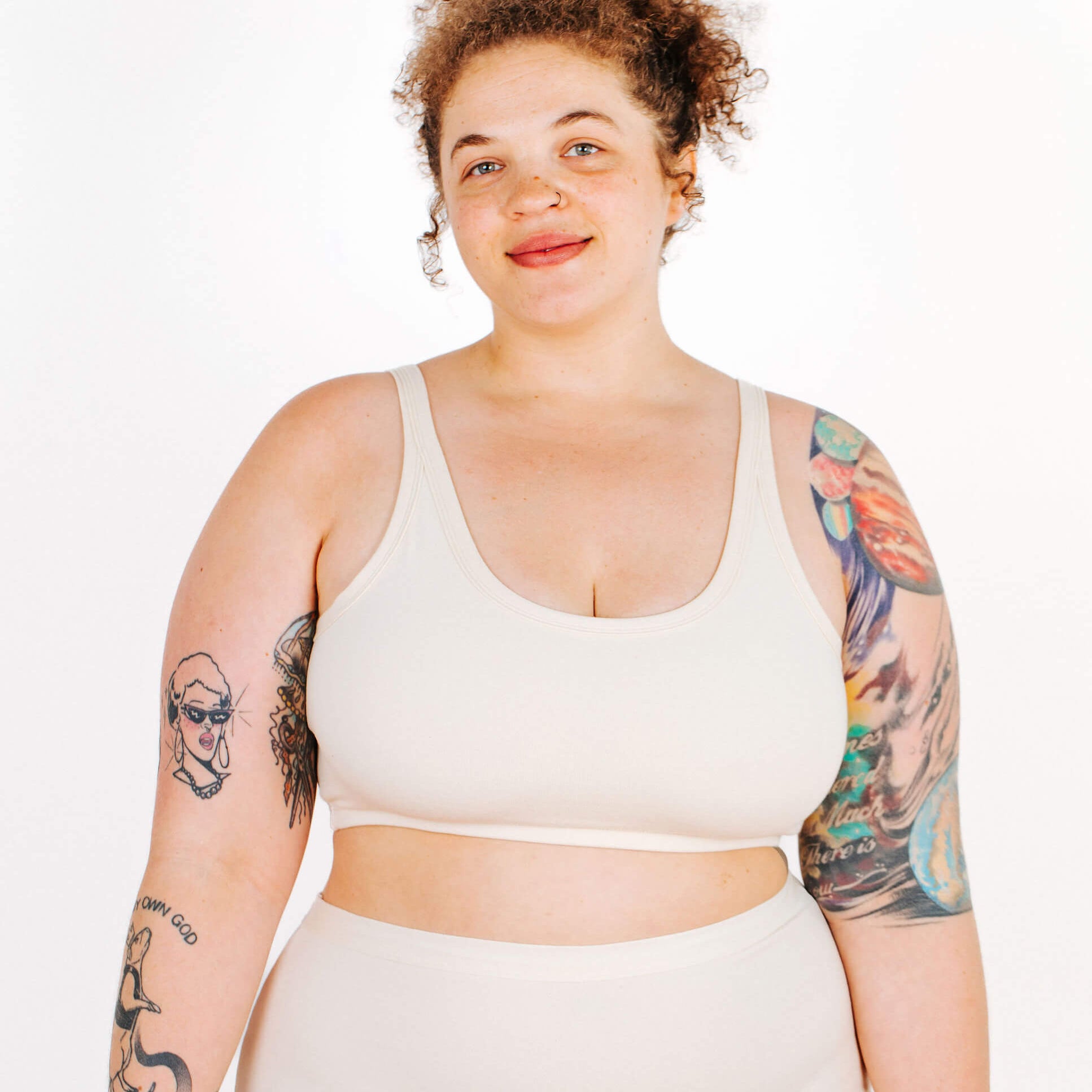 Fit photo from the front of Thunderpants organic cotton Longline Bra in off-white on a model.
