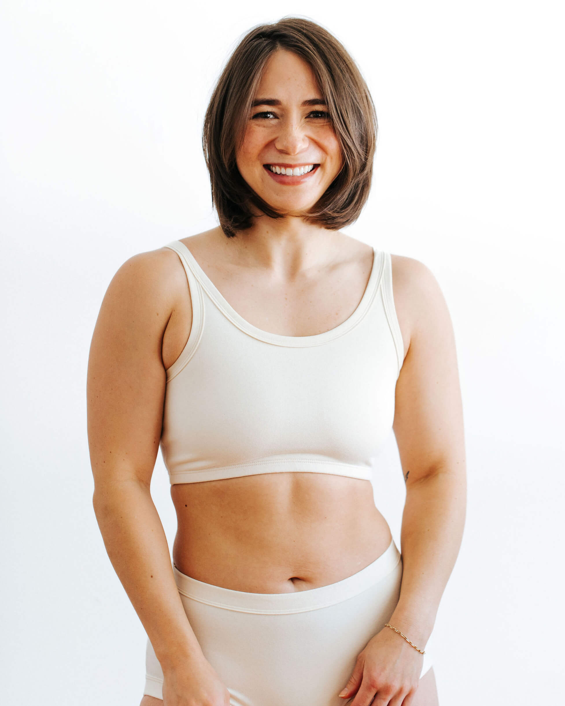 Fit photo from the front of Thunderpants organic cotton Longline Bra in off-white on a model.