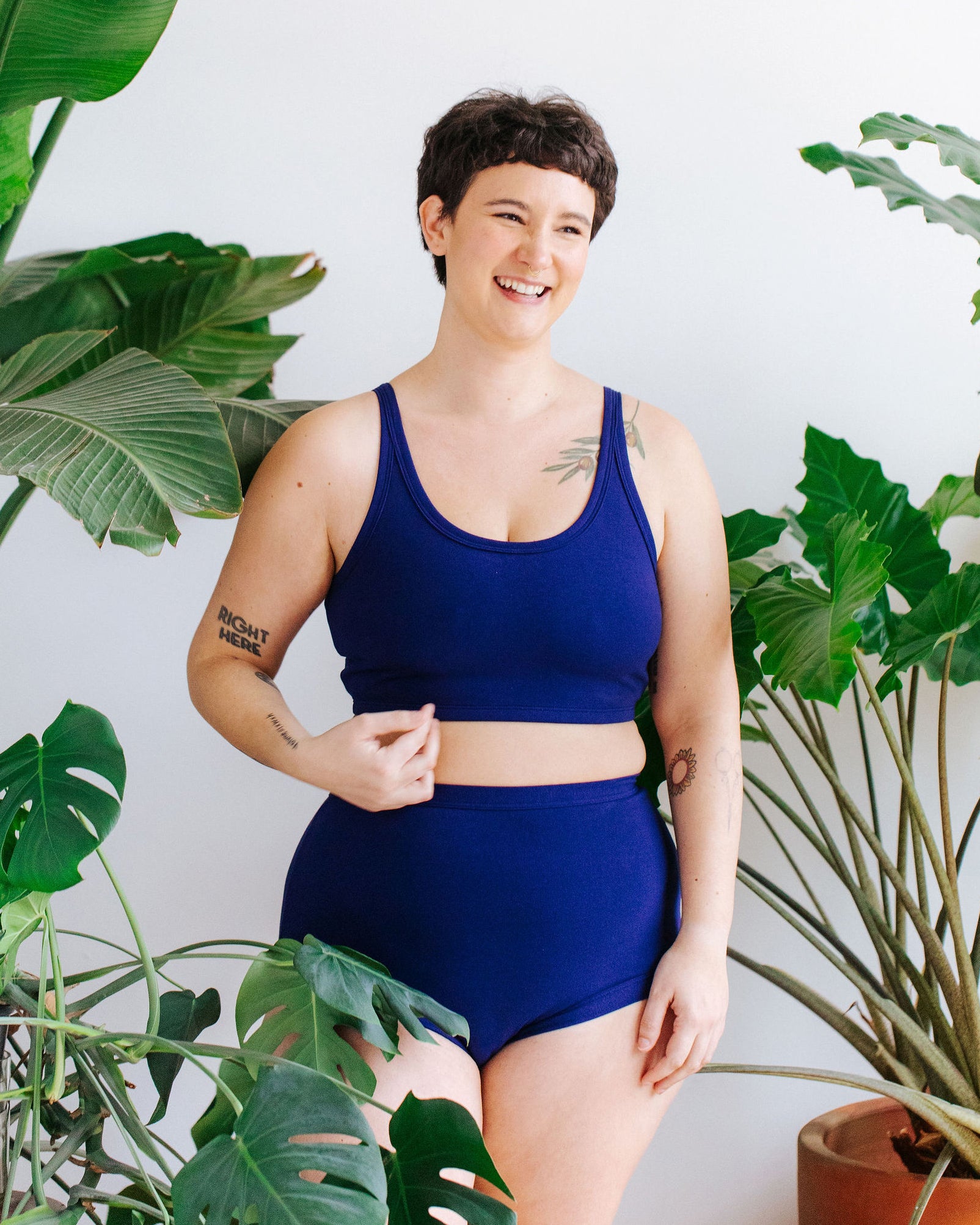 Model wearing Thunderpants Longline Bra and Sky Rise style underwear in Indigo Blue.