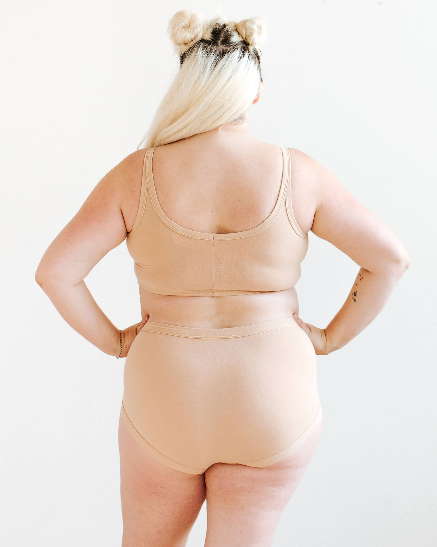 Model wearing Thunderpants Longline Bra and Original style underwear in Pine Nut - lighter tan color.