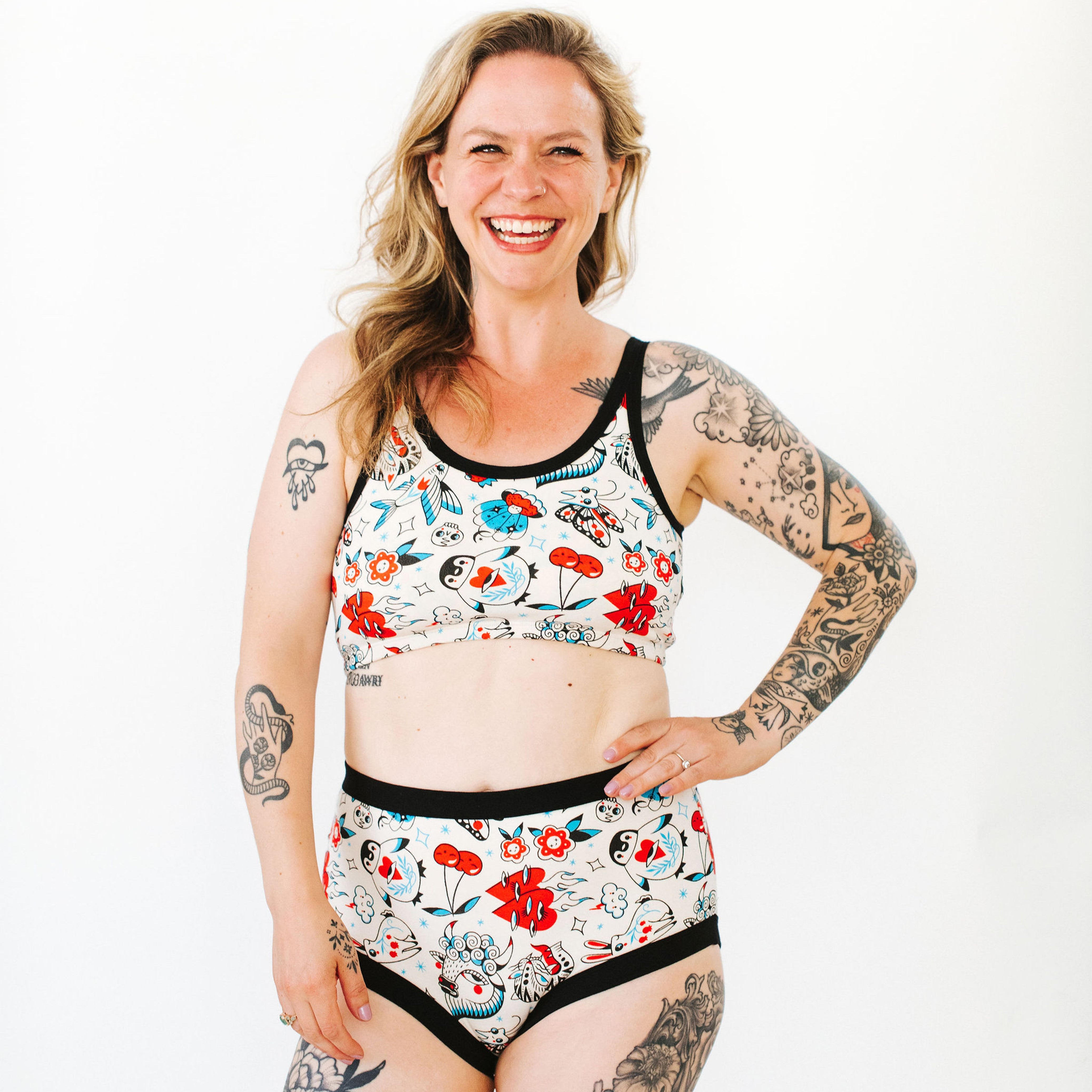 Model wearing various Thunderpants items in Inked Up - blue, red, and black tattoos.