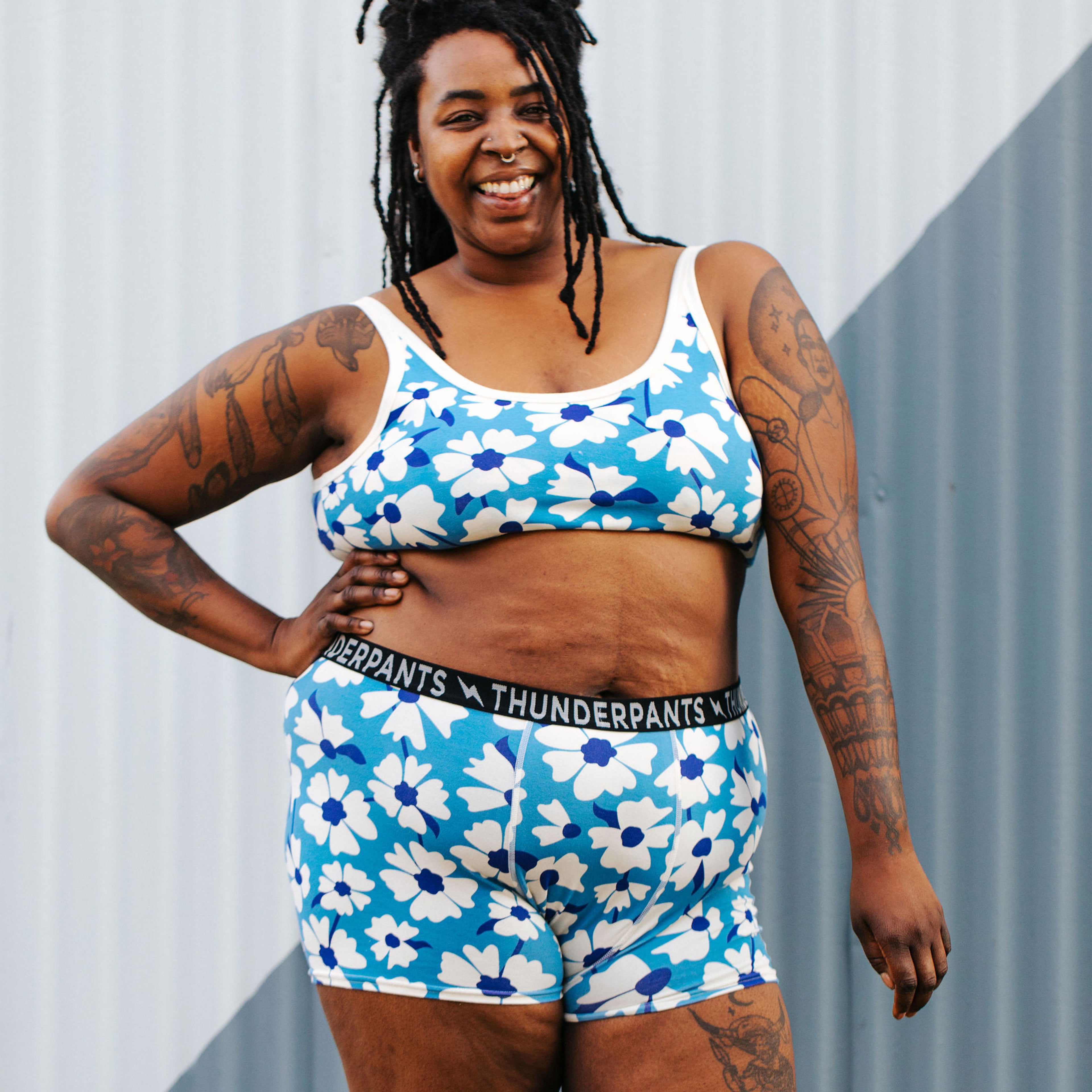 Model wearing Thunderpants Boxer Brief and Longline Bra in Moody Blooms print - blue and white flowers.