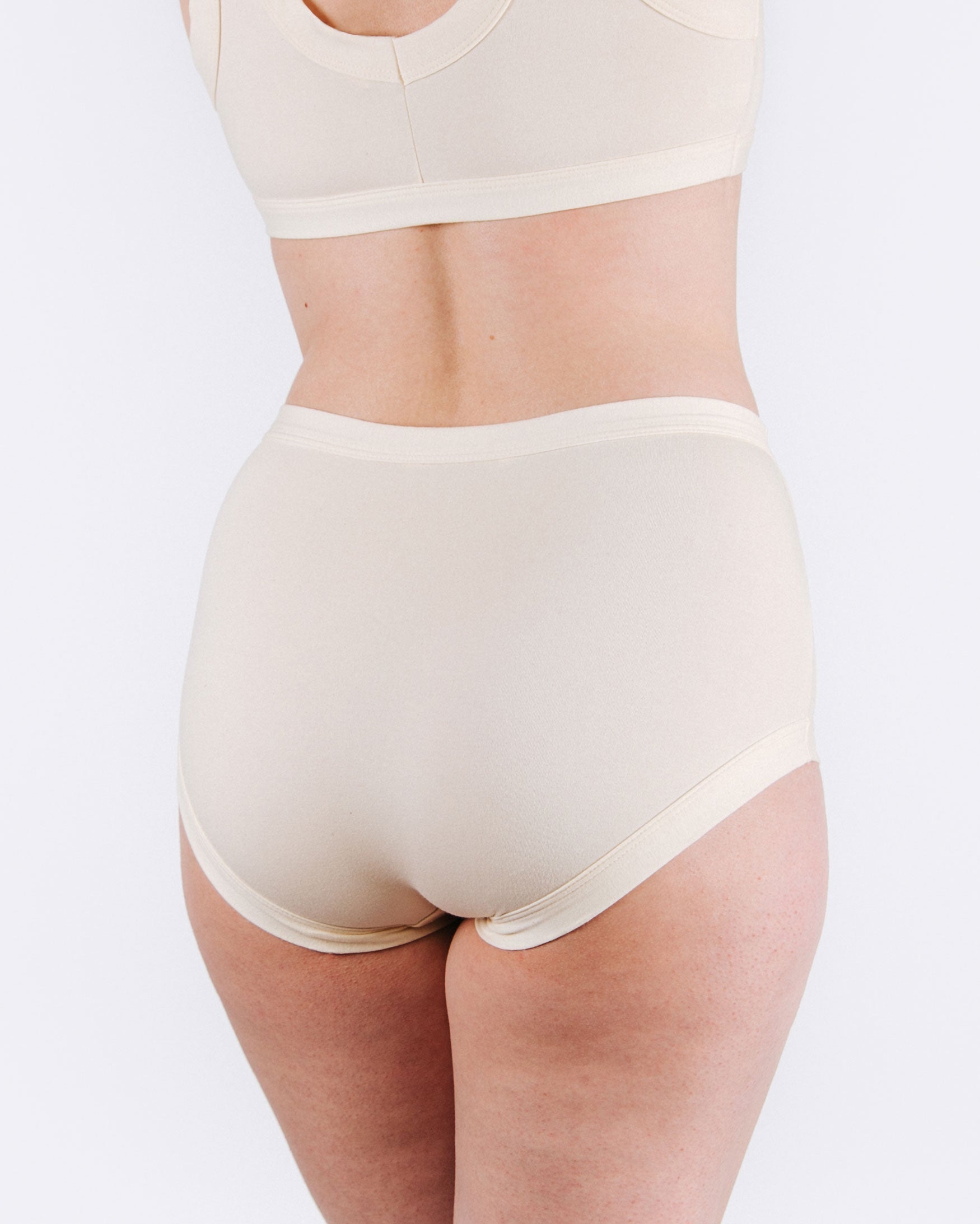 Fit photo from the back of Thunderpants organic cotton Original style underwear in off-white, showing a wedgie-free bum, on a model.