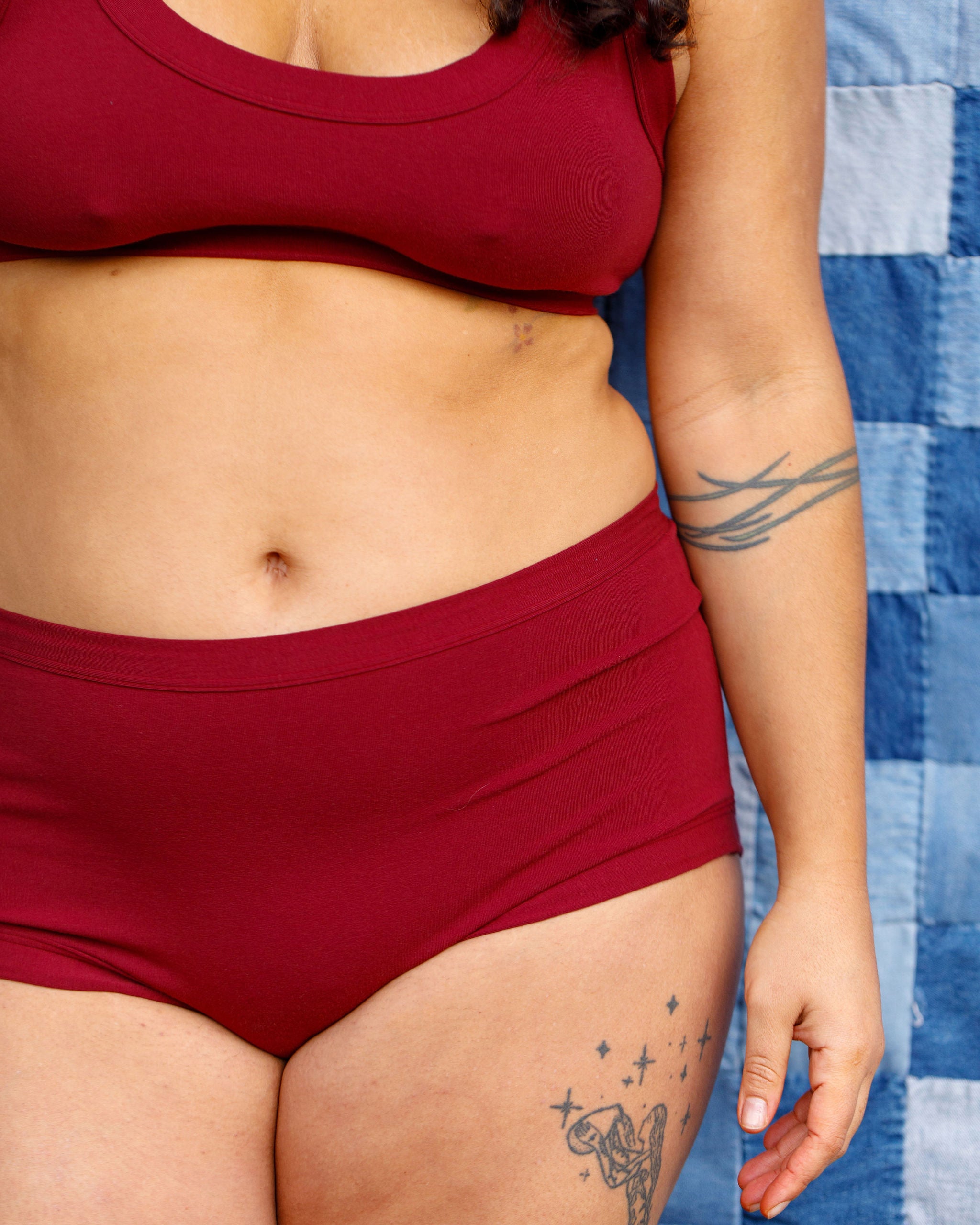 Model wearing Thunderpants Original style underwear and Bralette in Cabern-YAY - a deep wine red color.