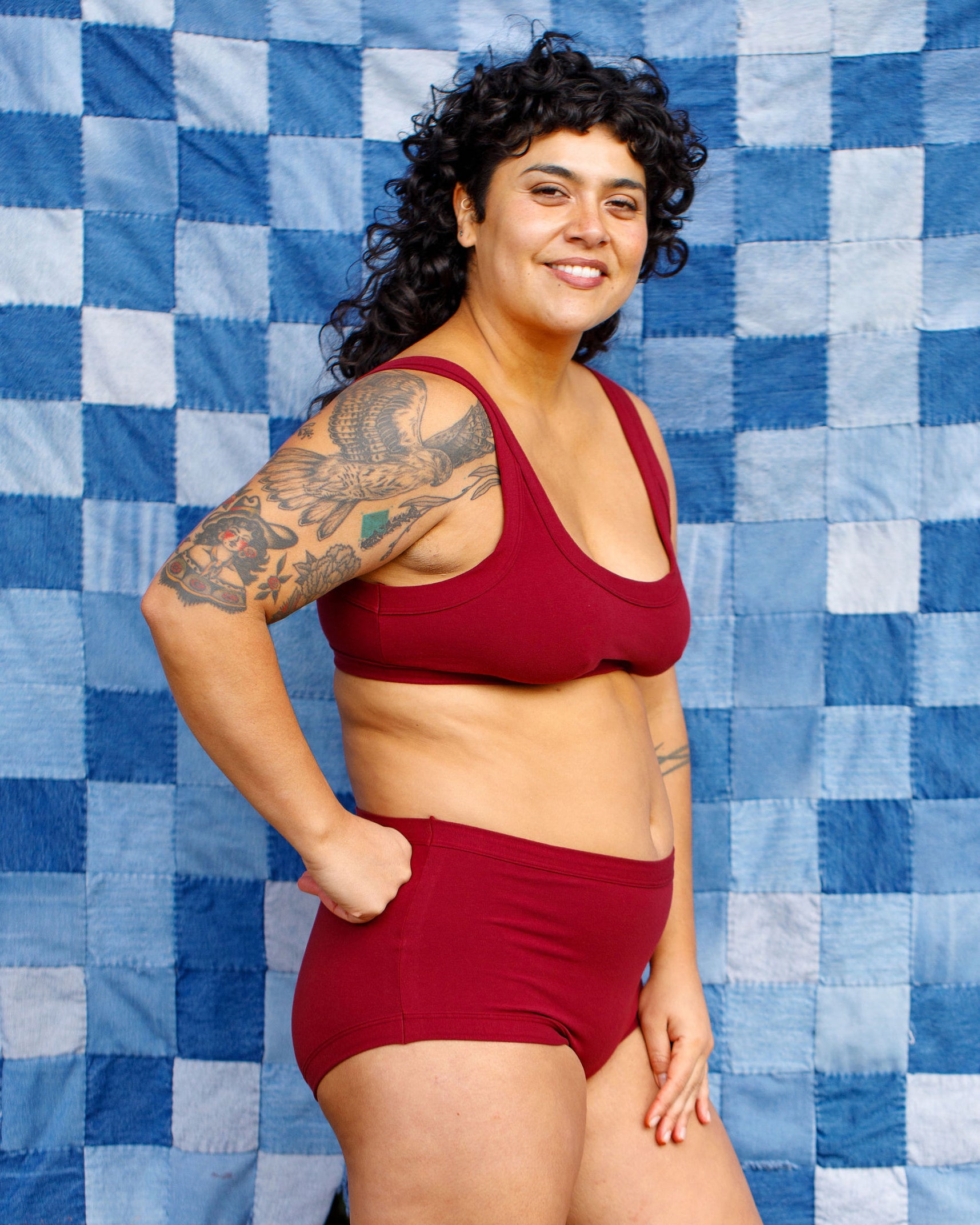 Model wearing Thunderpants Original style underwear and Bralette in Cabern-YAY - a deep wine red color.