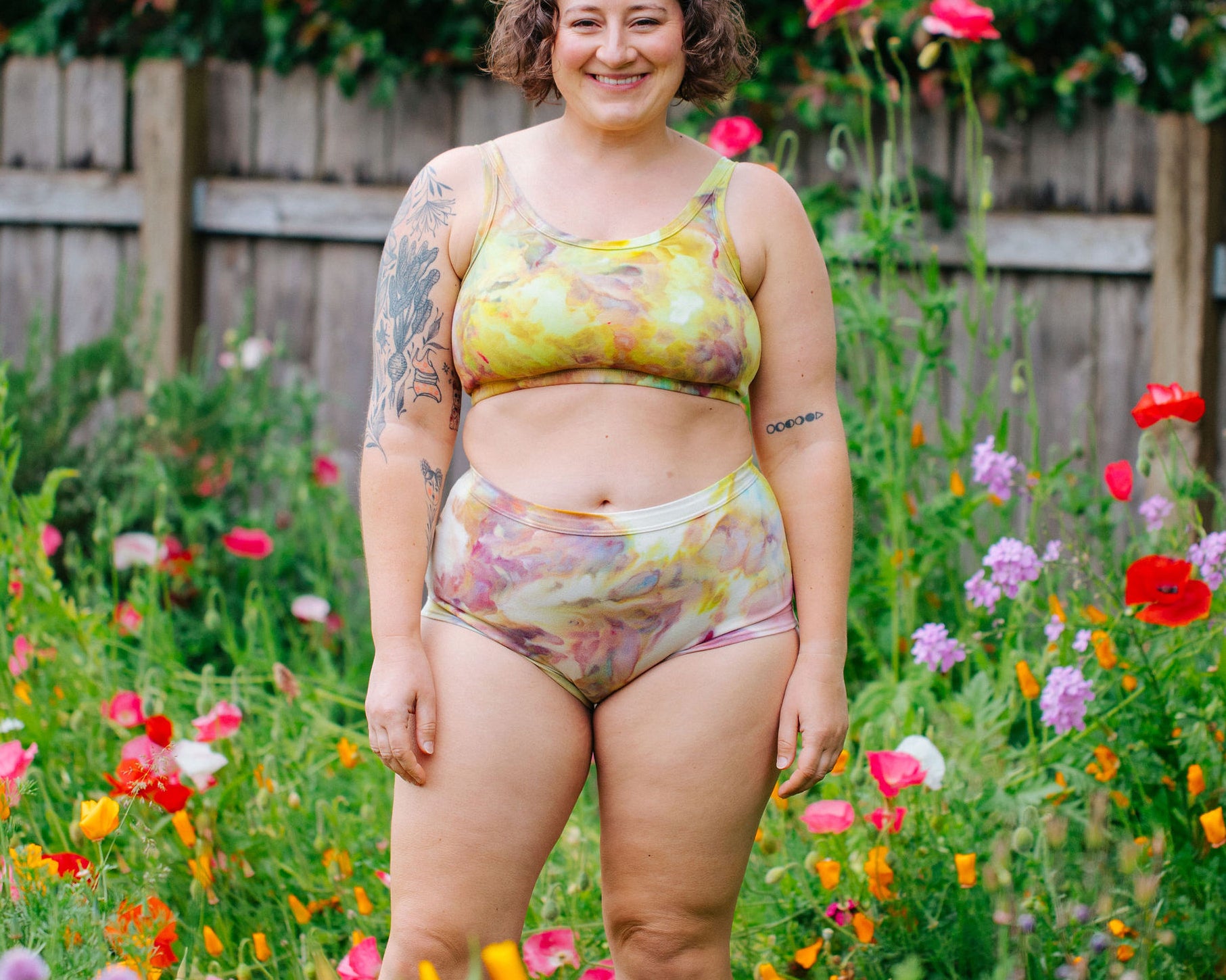 Model wearing Thunderpants Original style underwear and Longline Bra in Citrus Blossom Dye - hand dyed yellow, pink, and purple.