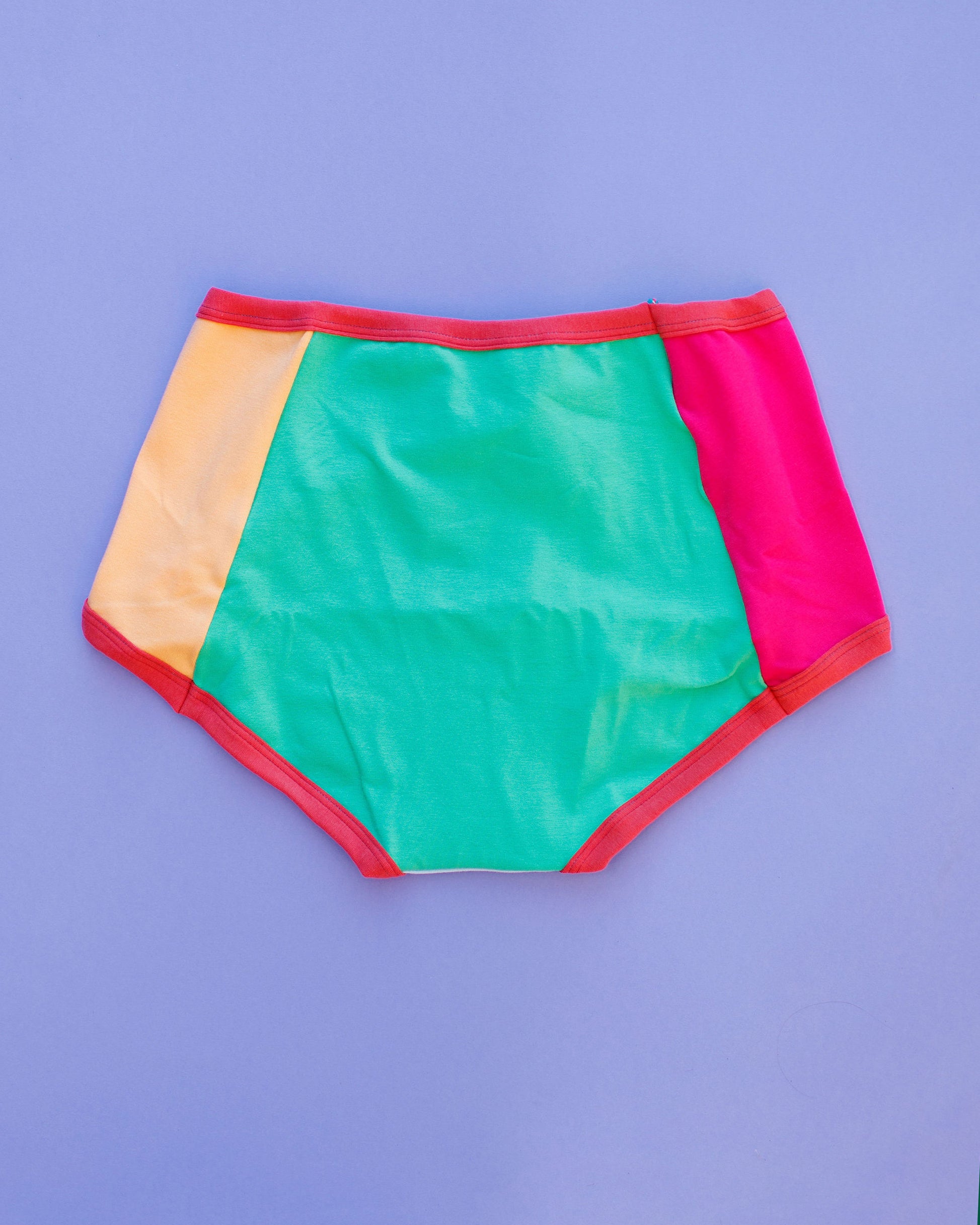 Flat lay of Thunderpants Panel Pants Original style underwear in Color Block Scraps - various solid colors.