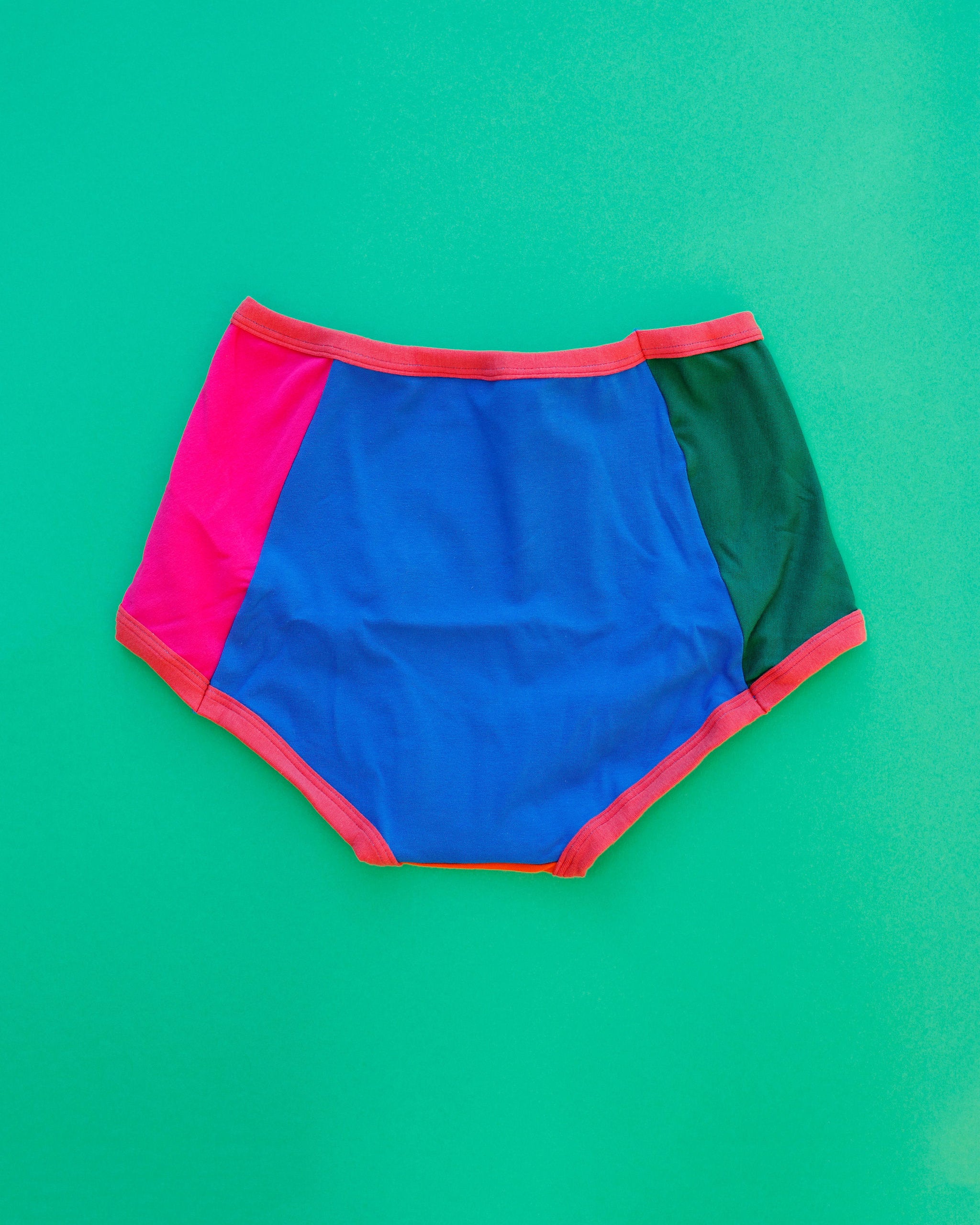Flat lay of Thunderpants Panel Pants Original style underwear in Color Block Scraps - various solid colors.