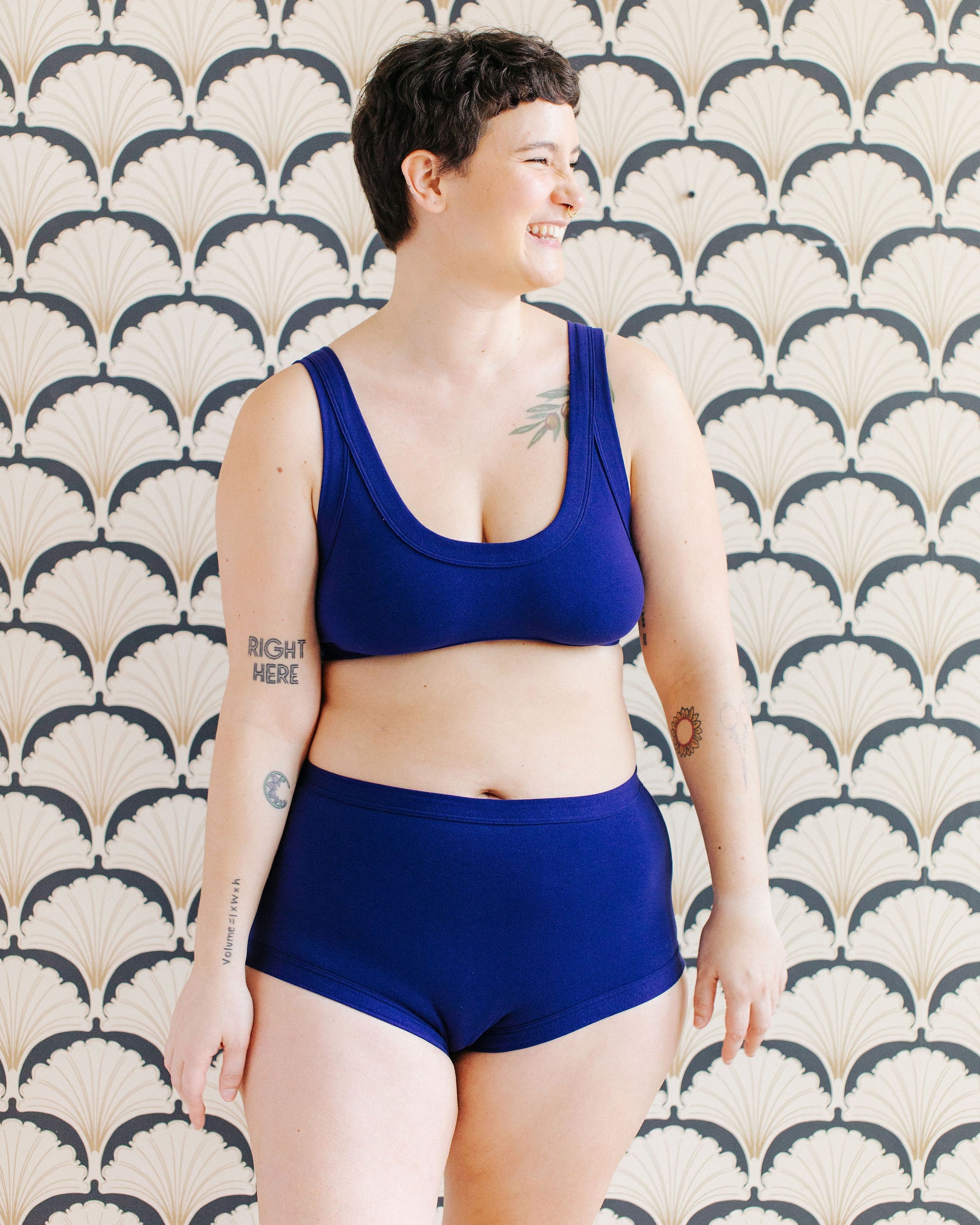 Model wearing Thunderpants Original style underwear and Bralette in Indigo blue.