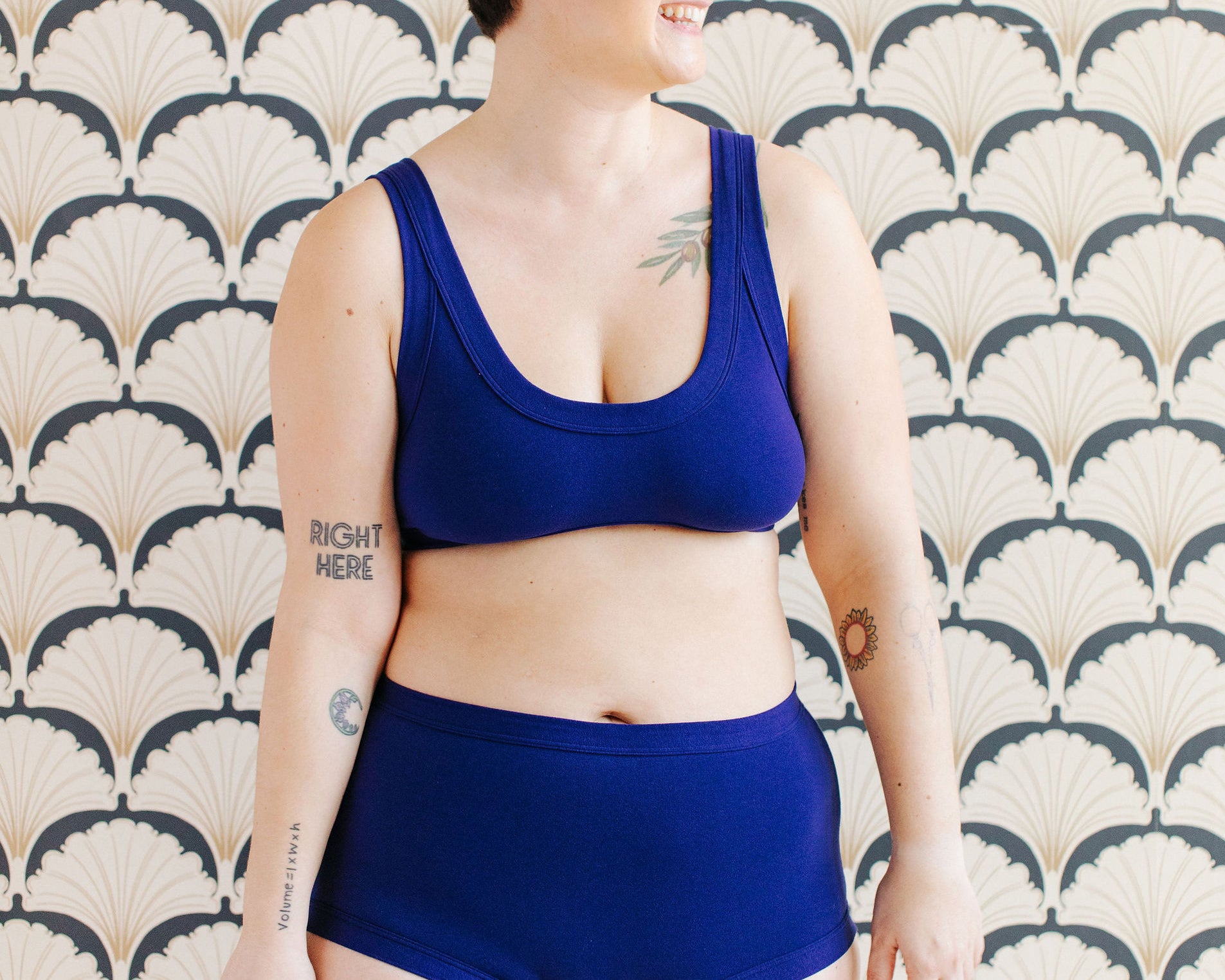 Model wearing Thunderpants Original style underwear and Bralette in Indigo blue.