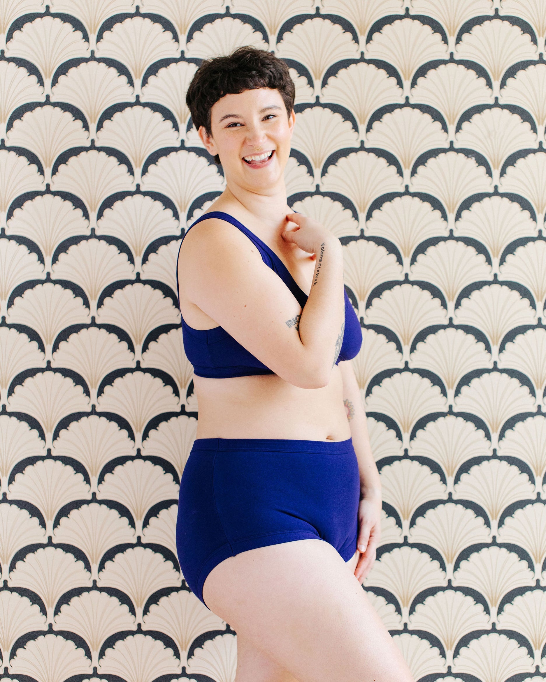 Model wearing Thunderpants Original style underwear and Bralette in Indigo blue.