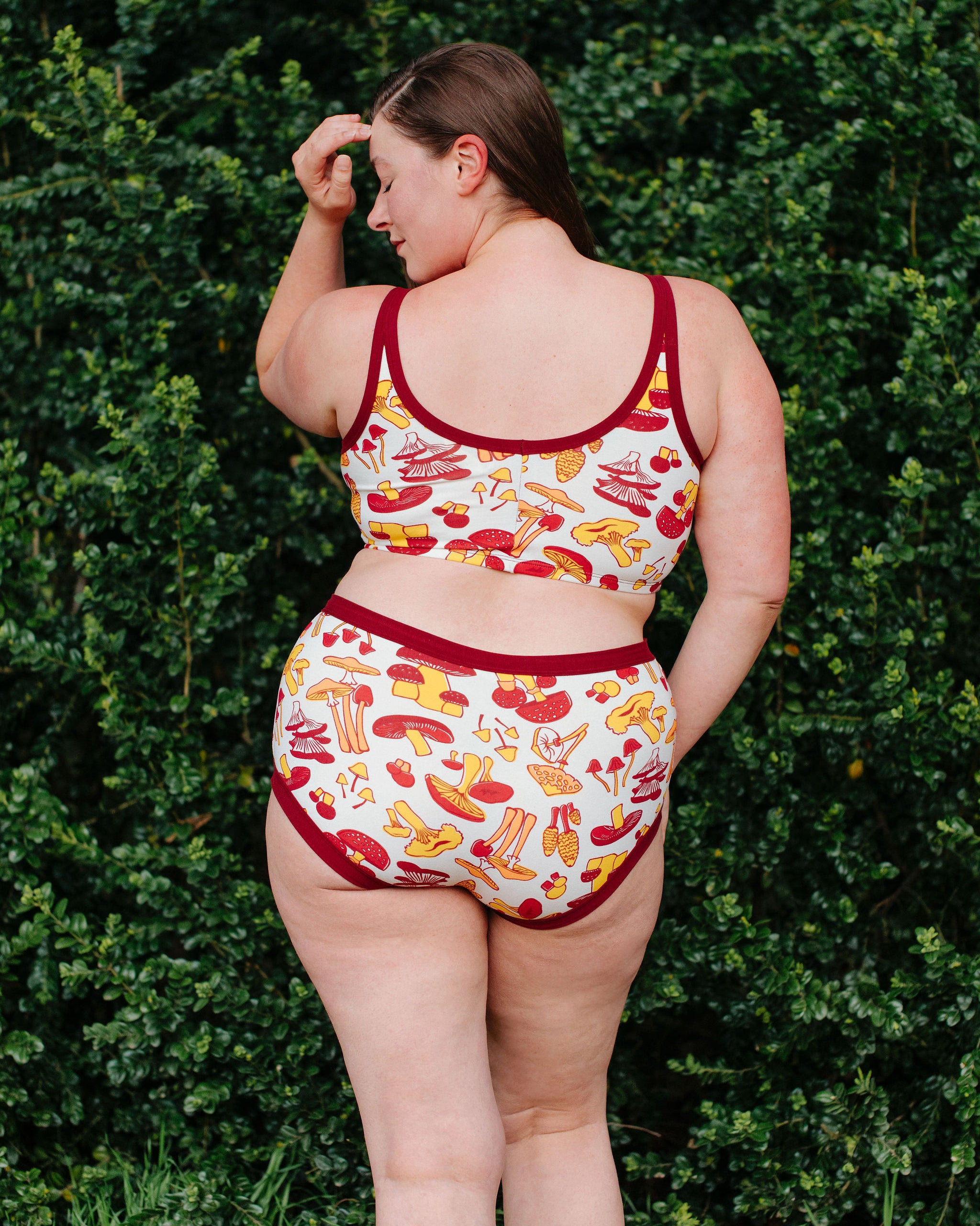 Model wearing Thunderpants Original style underwear  and Longline Bra in Whadda Fungi - red, orange, and yellow mushroom print.