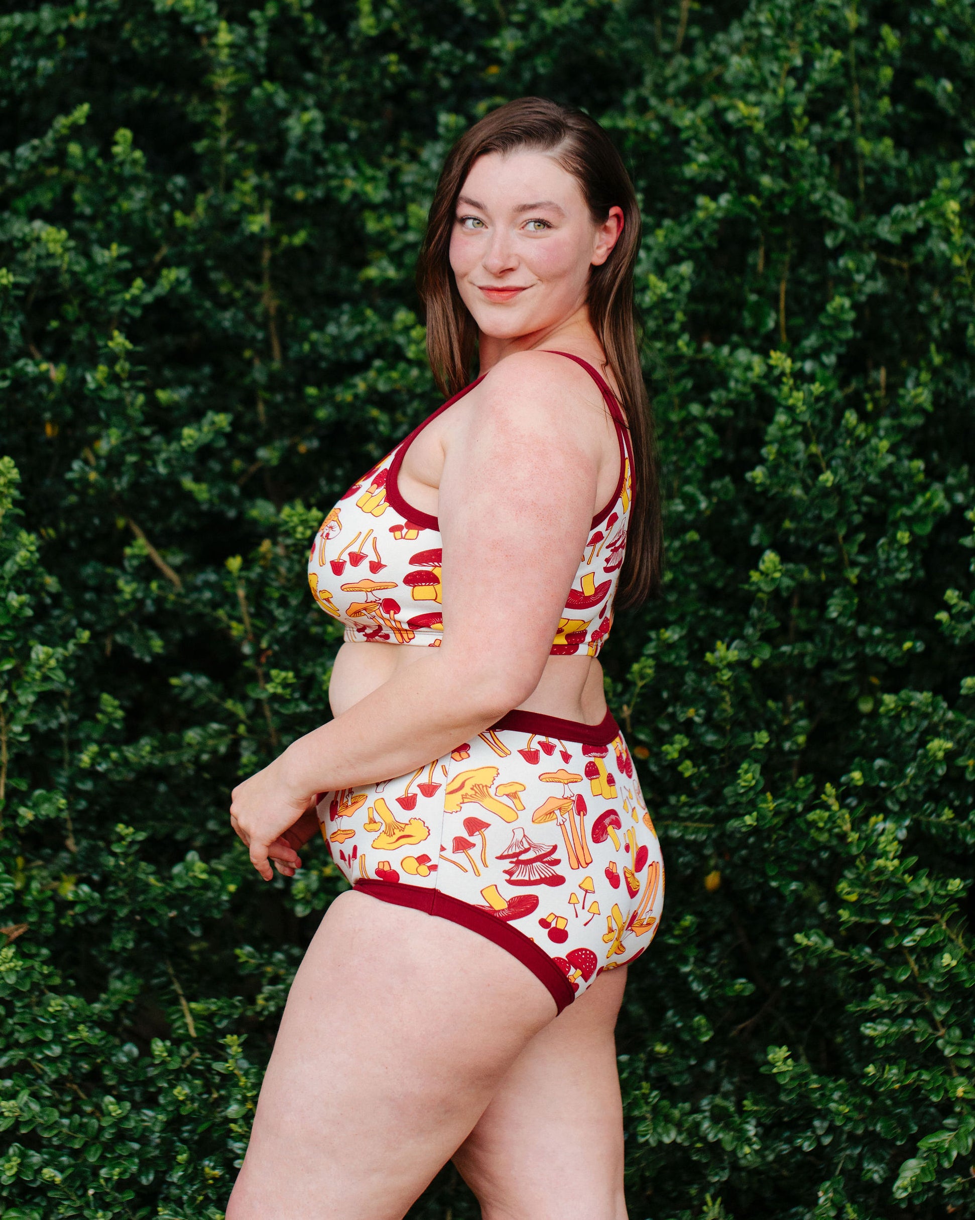 Model wearing Thunderpants Original style underwear  and Longline Bra in Whadda Fungi - red, orange, and yellow mushroom print.